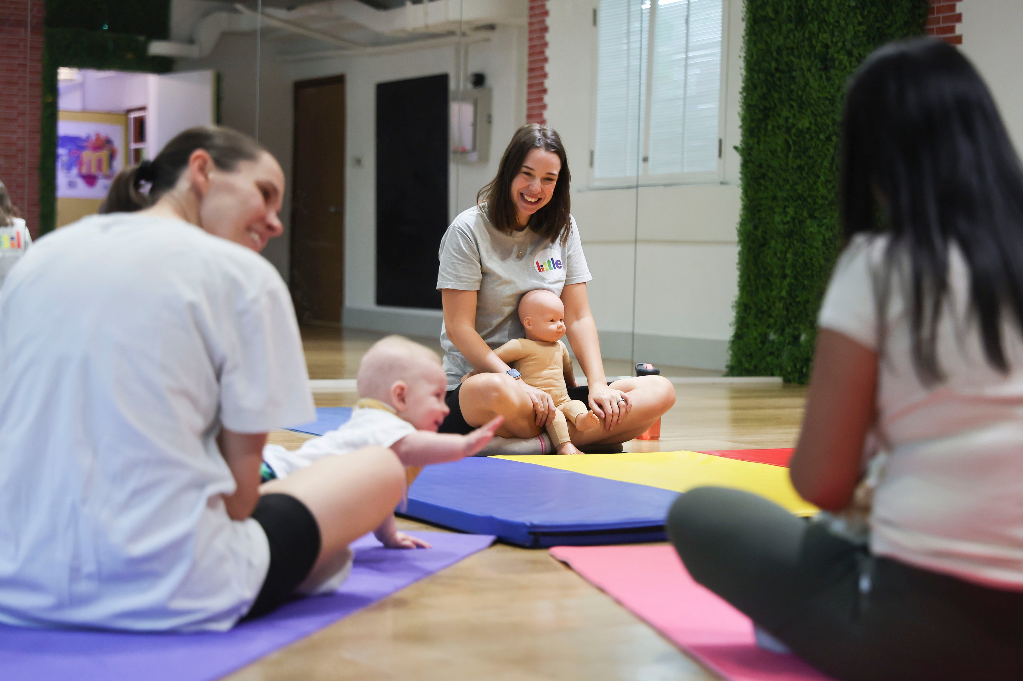 Baby massage eased postnatal depression for Jen Cooper (centre), who is now a teacher of baby movement classes in Hong Kong. Photo: Edmond So