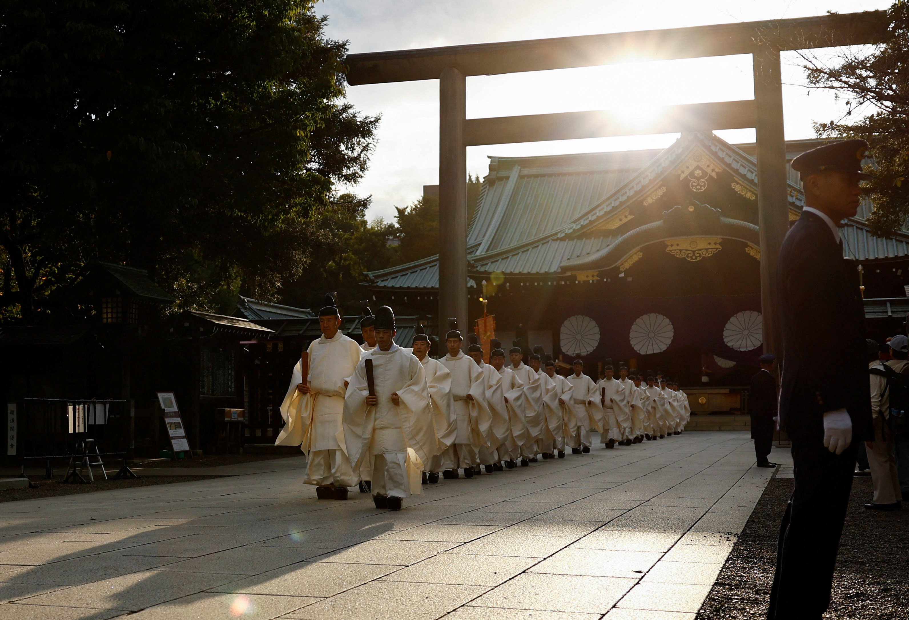 Japanese Shinto priests attend a ritual during an autumn festival at Yasukuni Shrine in Tokyo. Photo: Reuters