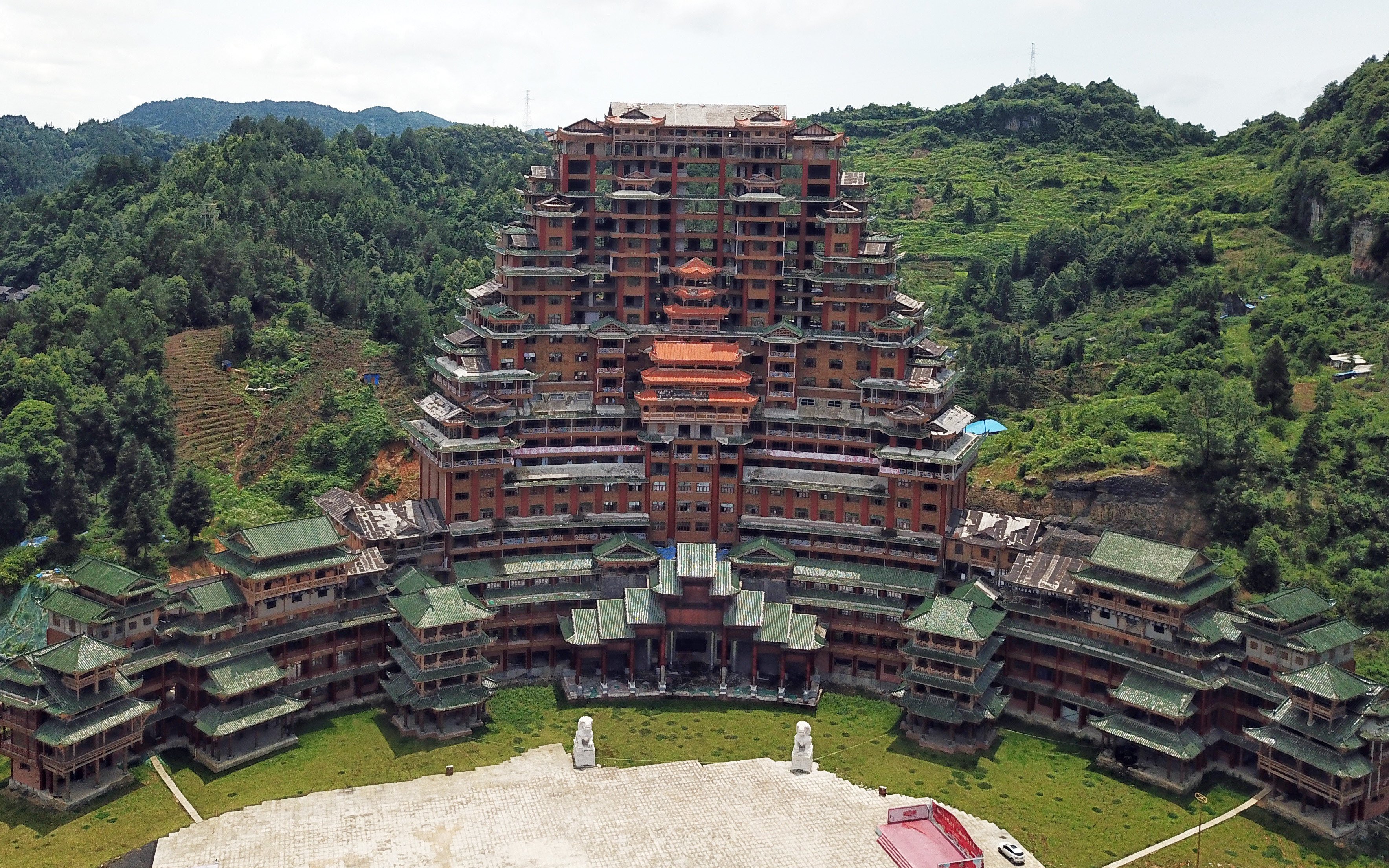 A massive wooden structure in a county of China’s Guizhou province has become a symbol of reckless spending and unsustainable debt. Photo: Xinhua