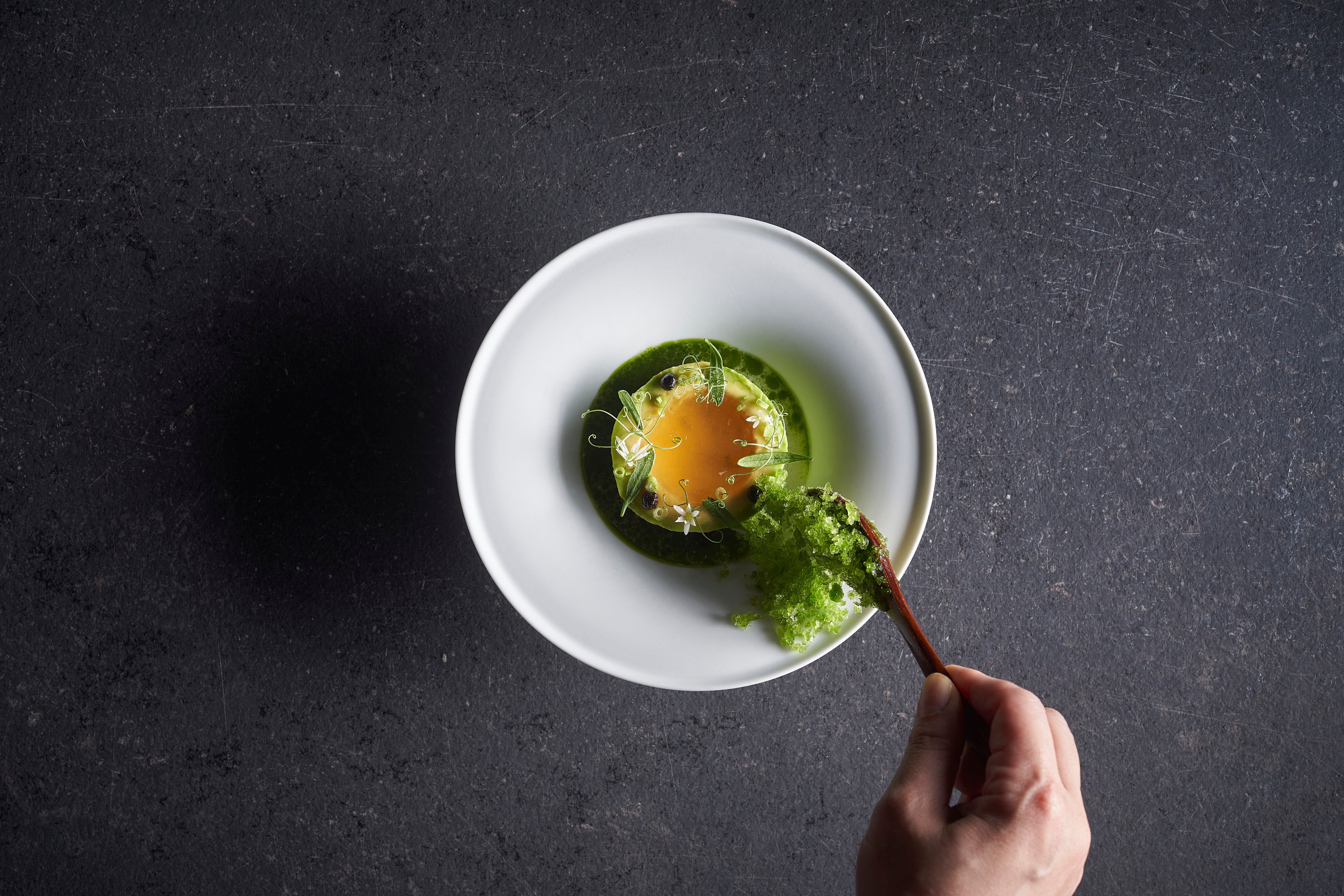 Avocado, smoked eel, eel consomme, yuzu dish at Lolla. Photo: Asia’s 50 Best Resturants