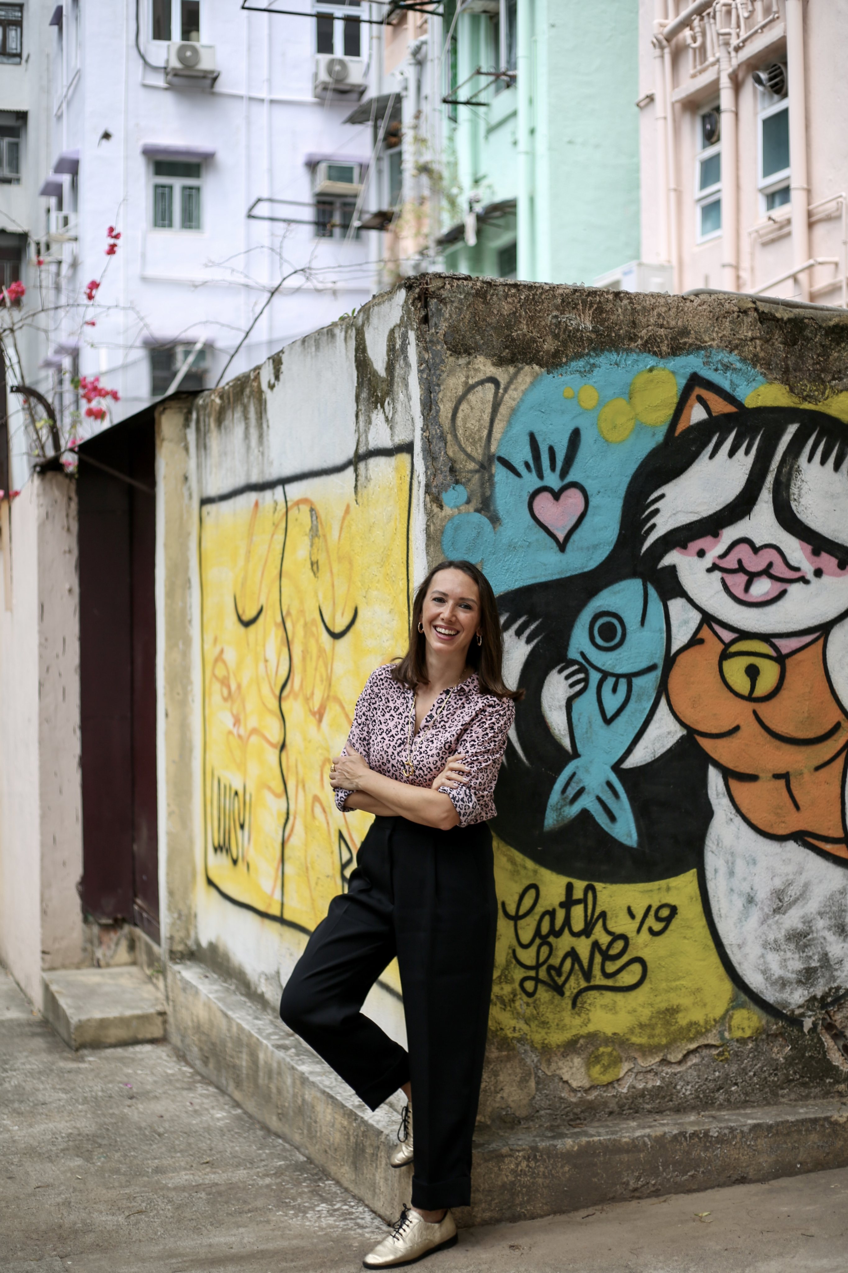 Claire Yates behind The Lion Rock Press headquarters in Sheung Wan 2022. Photo: Jennifer Robertson