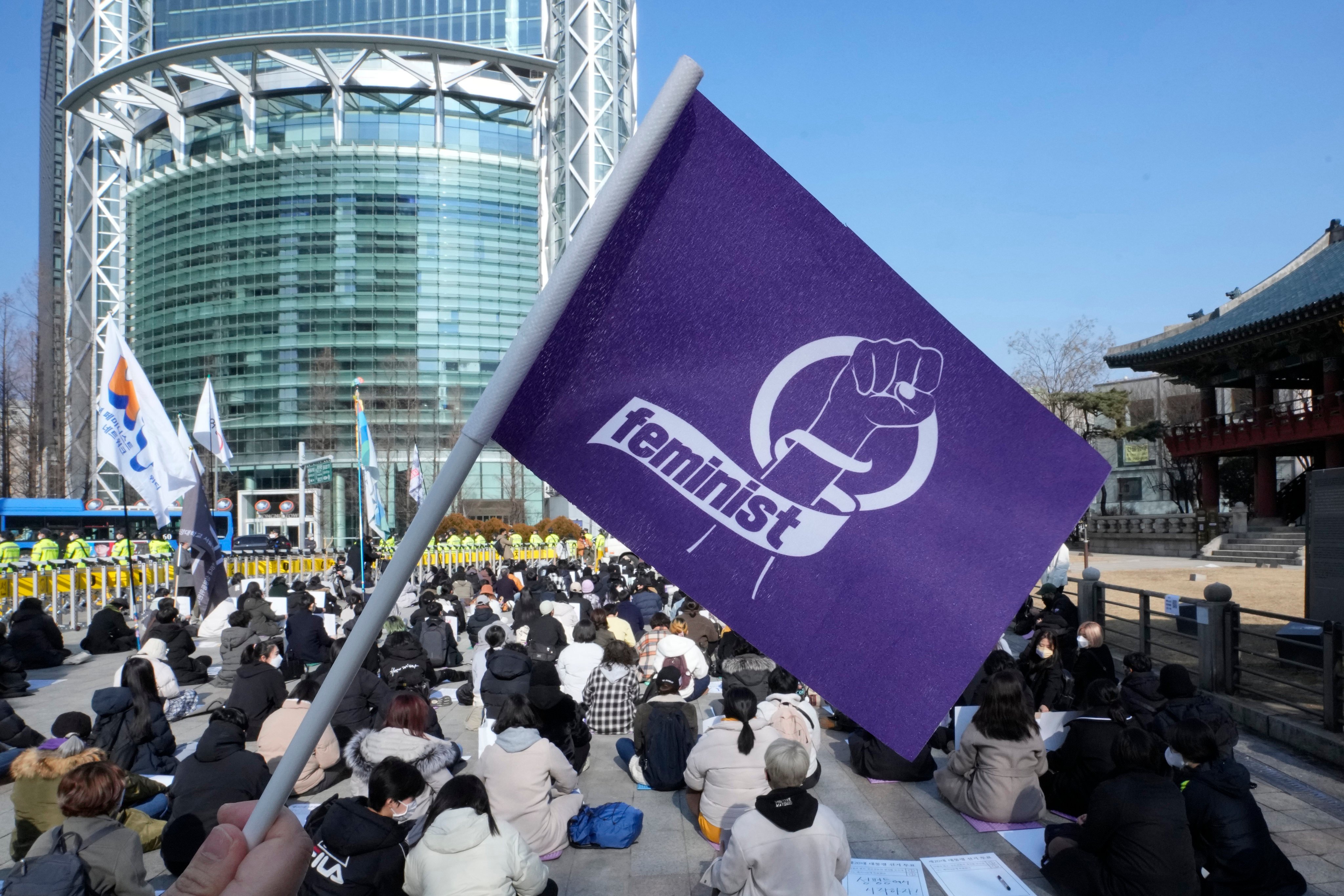 People stage a rally supporting feminism in Seoul, South Korea. Amid a deeply entrenched culture of misogyny and harassment, Korean women have been attacked for having short hair. Photo: AP