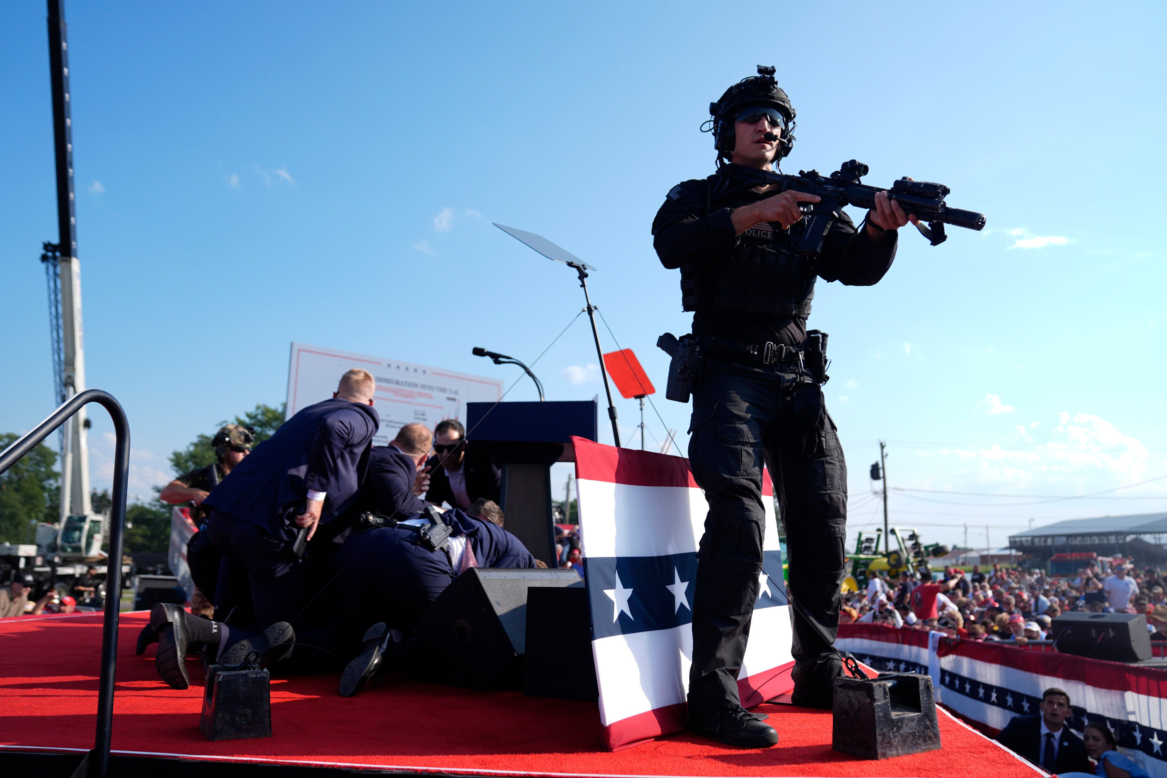 Republican presidential candidate former president Donald Trump is covered by Secret Service agents at a campaign rally in Butler in July. Photo: AP