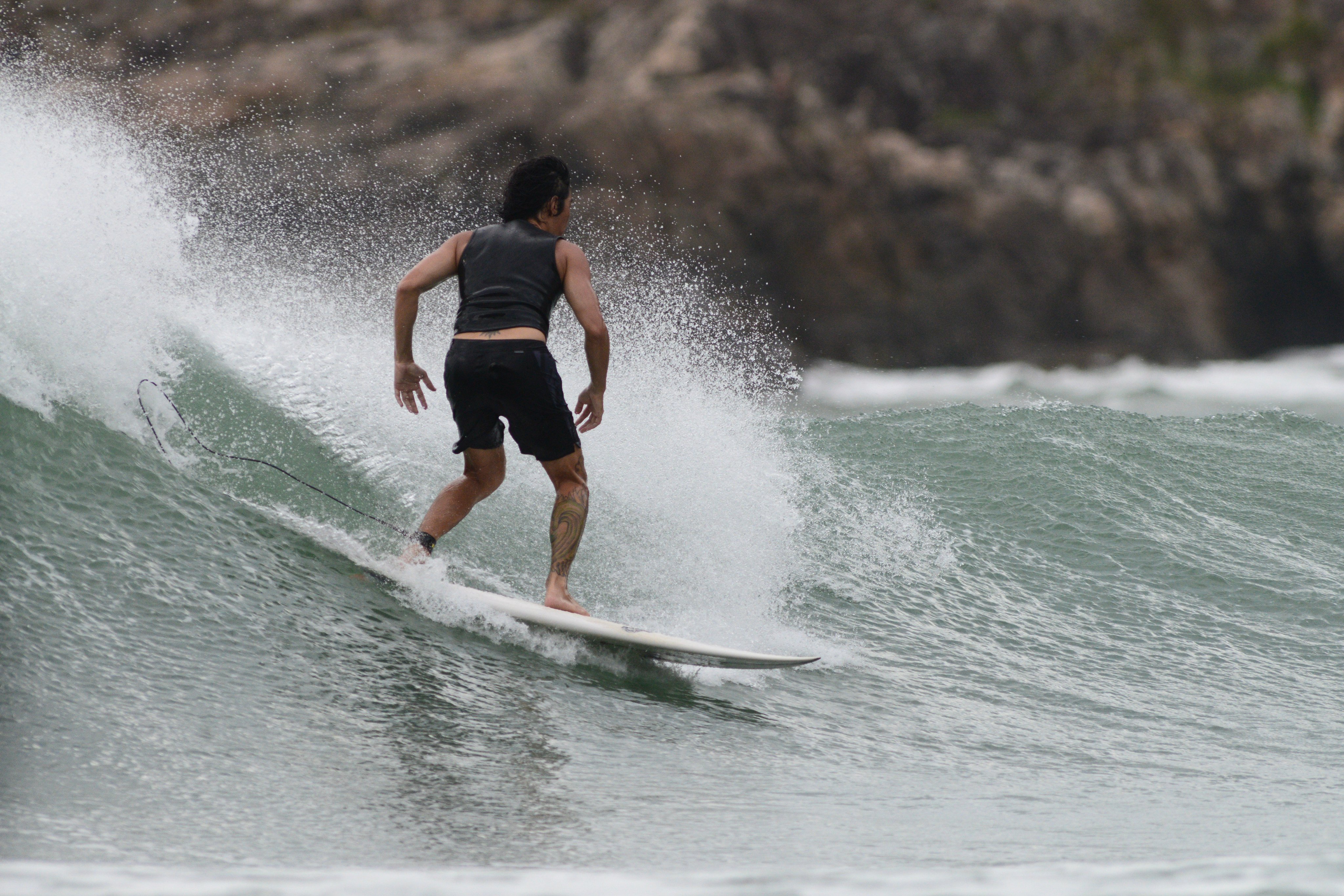 A surfer at Big Wave Bay. In the eyes of the surfing community, the sport is being unfairly singled out by authorities. Photo: Antony Dickson 