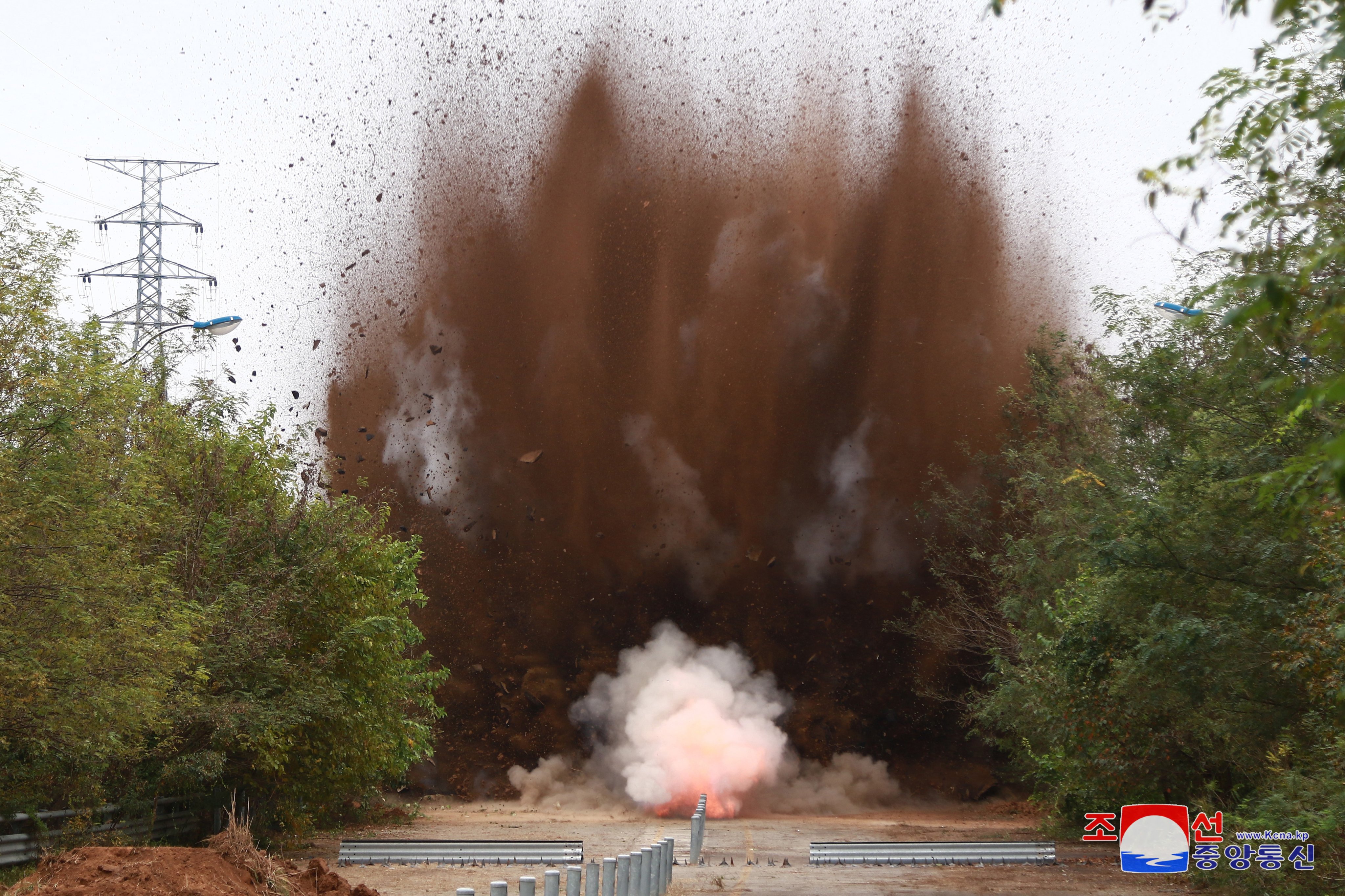 A photo released by North Korea on Thursday shows an explosion along a road connecting it with neighbouring South Korea. Photo: EPA