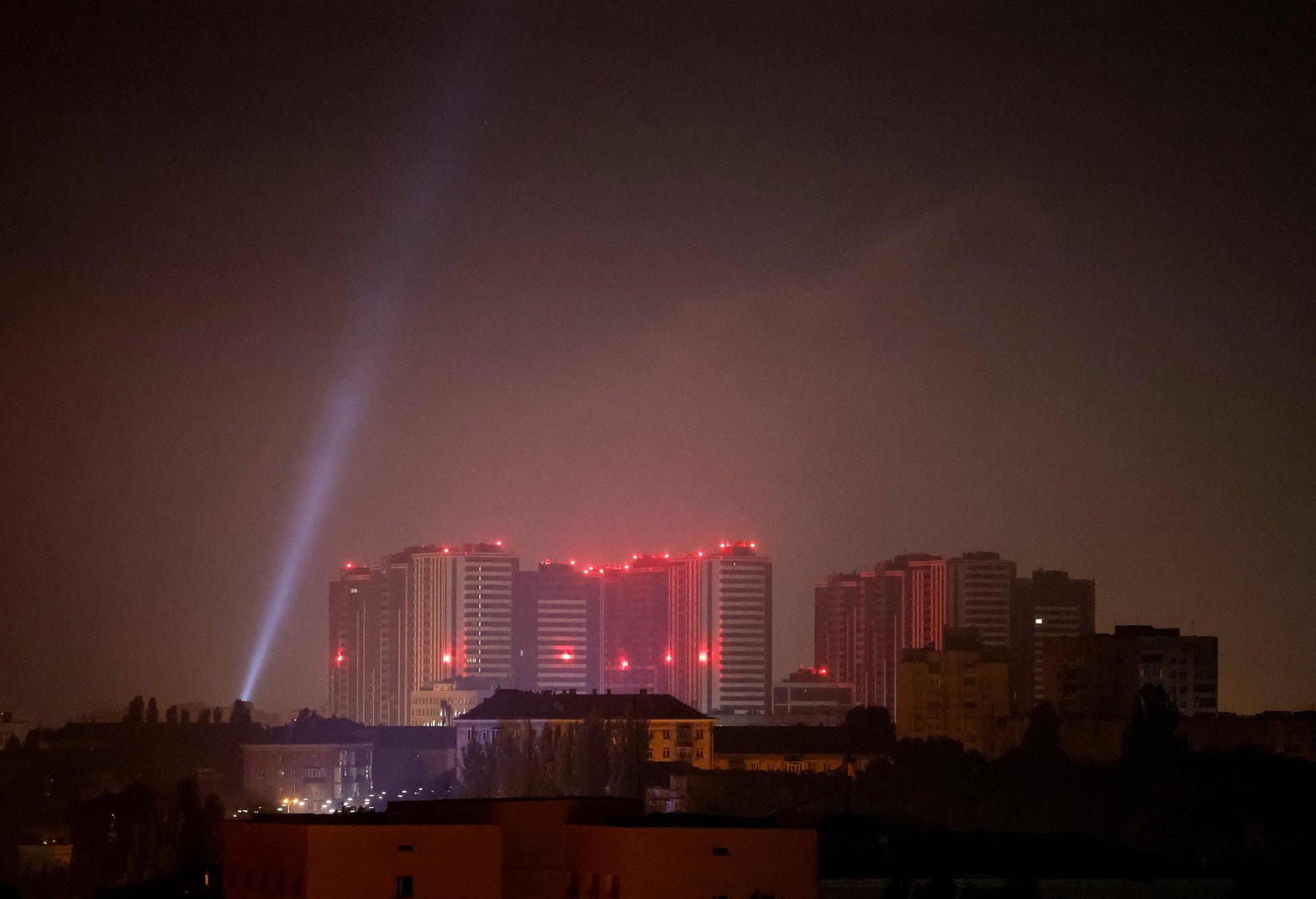 Ukrainian personnel use searchlights to look for drones in the sky over Kyiv during a Russian attack on October 11. Photo: Reuters