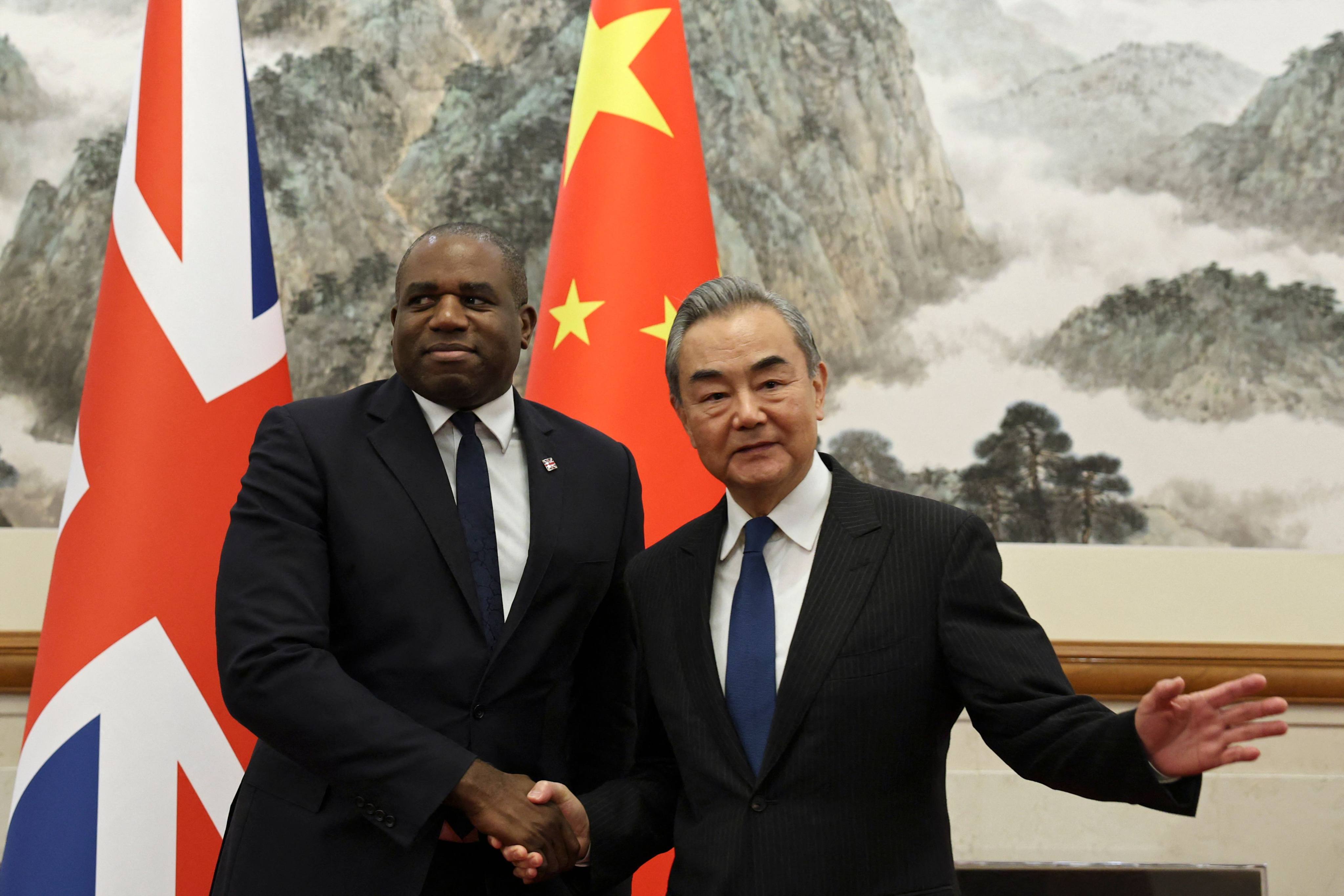 British Foreign Secretary David Lammy  and Chinese Foreign Minister Wang Yi  before their meeting in Beijing on Friday. Photo: AFP