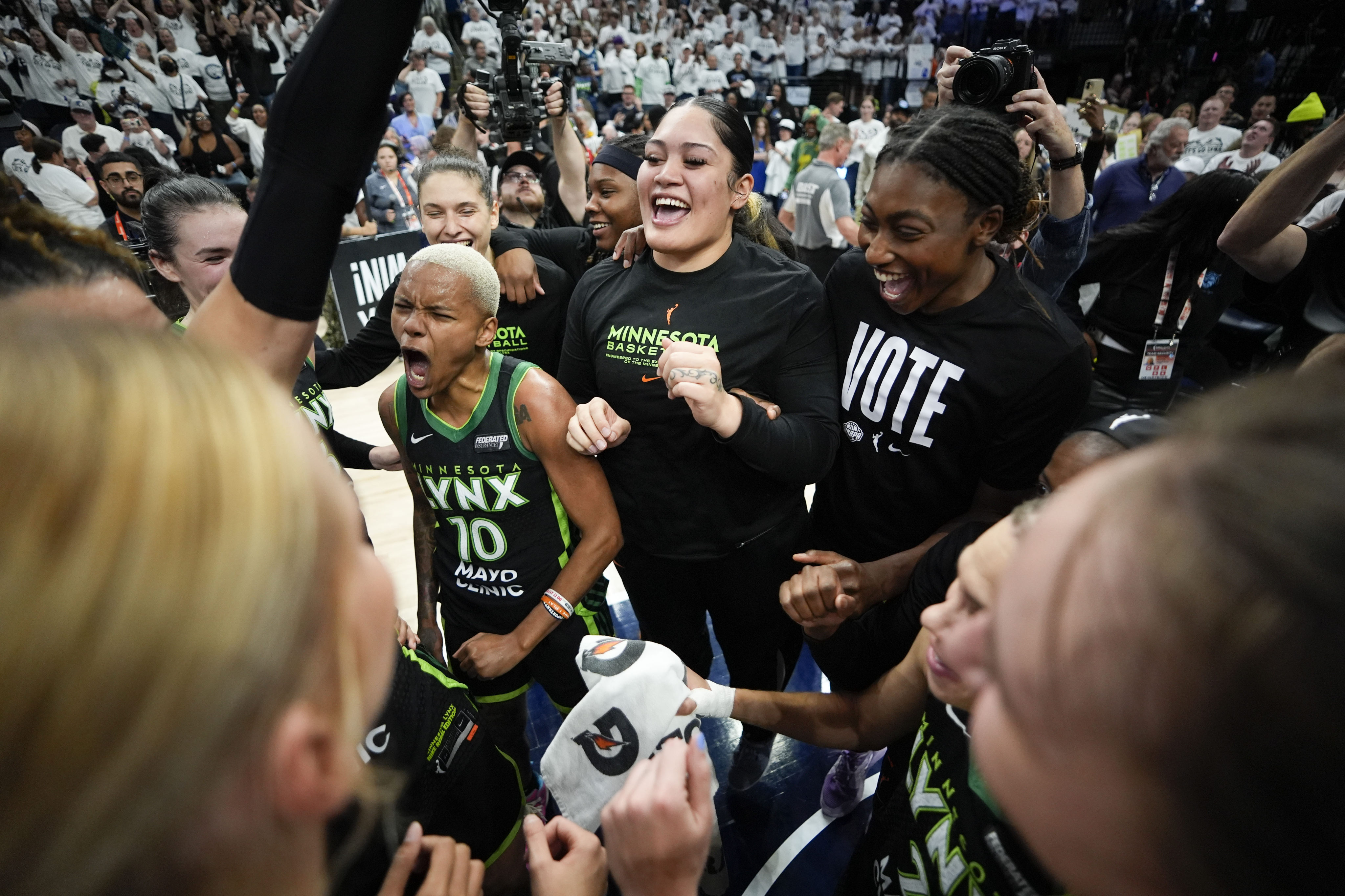 Minnesota Lynx players celebrate their victory over the New York Liberty, which takes the WNBA final playoff series to Game 5. Photo: AP