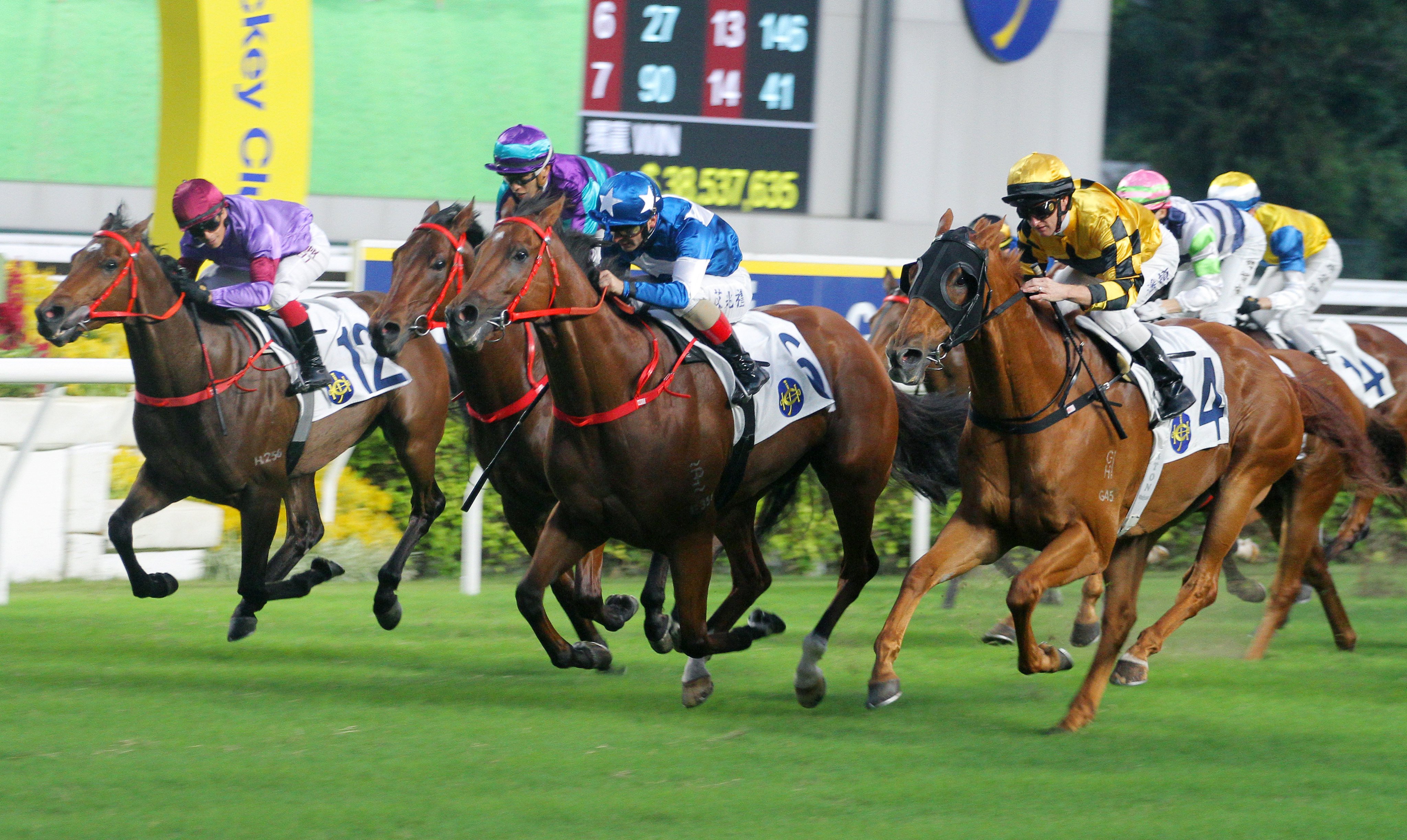 Lucky With You (centre) storms home to win under Andrea Atzeni last year. Photos: Kenneth Chan