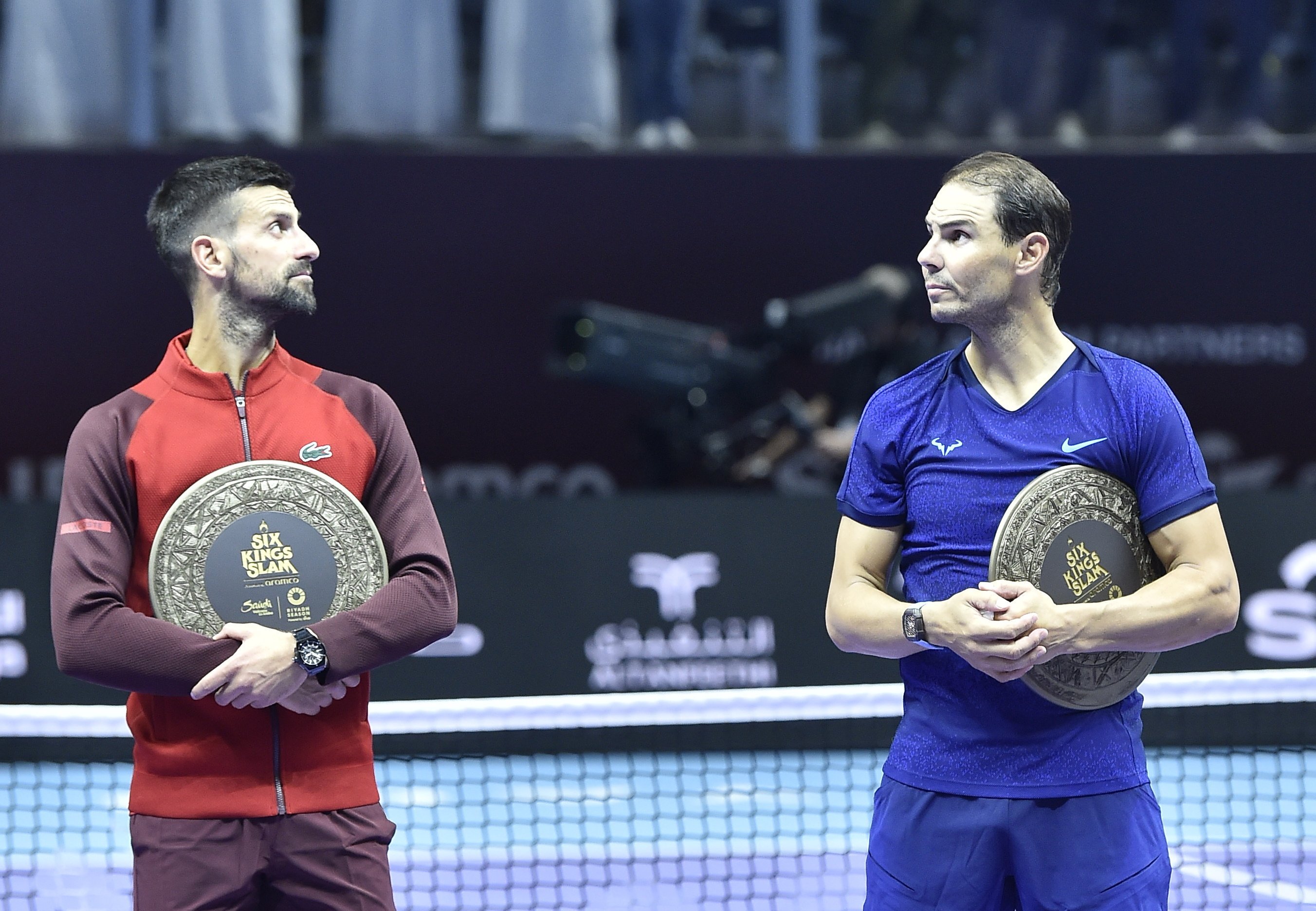 Novak Djokovic and Rafel Nadal with their third and fourth-place trophies after meeting at the “Six Kings Slam” exhibition in Saudi Arabia. Photo: EPA