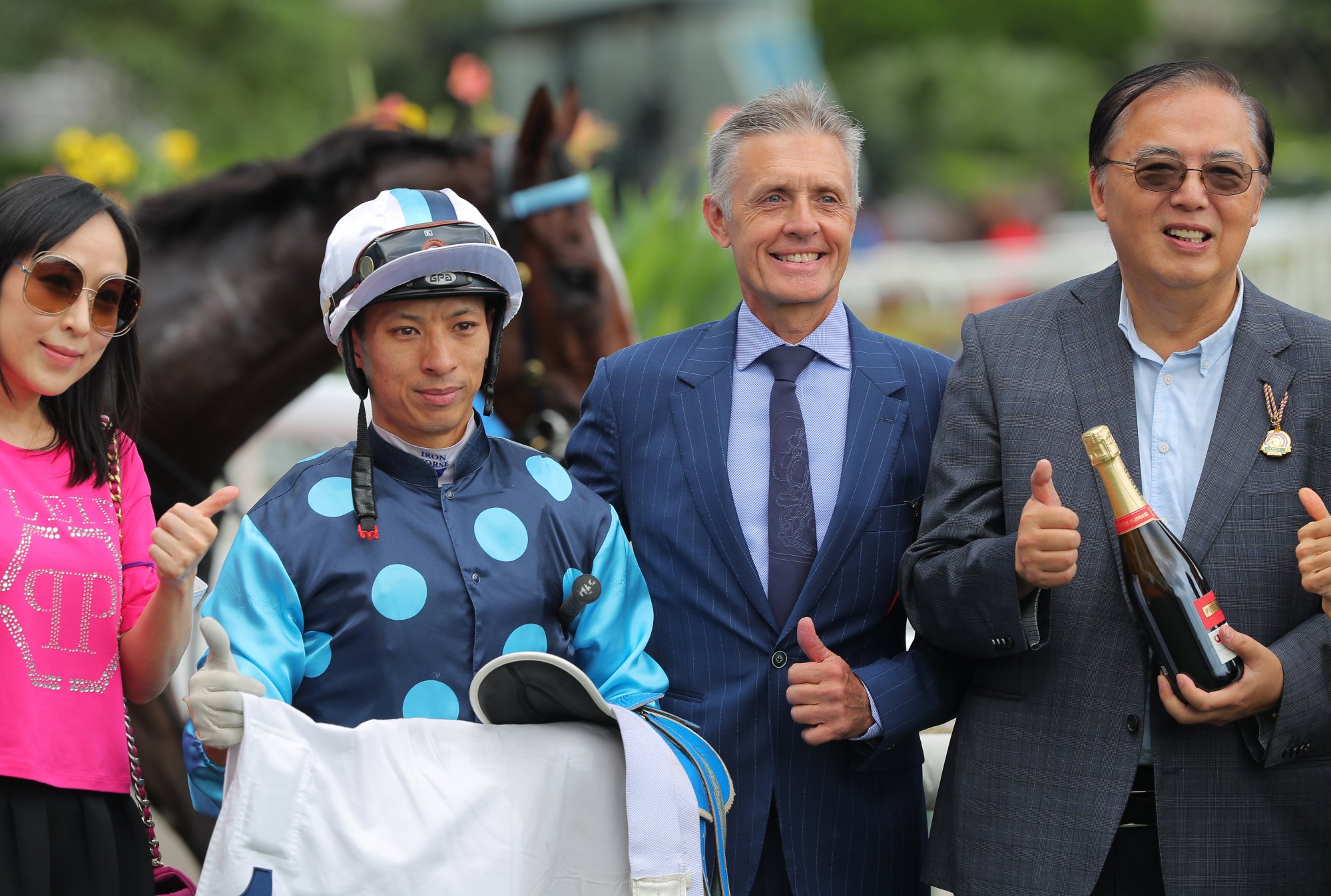 Jockey Matthew Chadwick, Mark Newnham and connections of Win Speed celebrate their win.