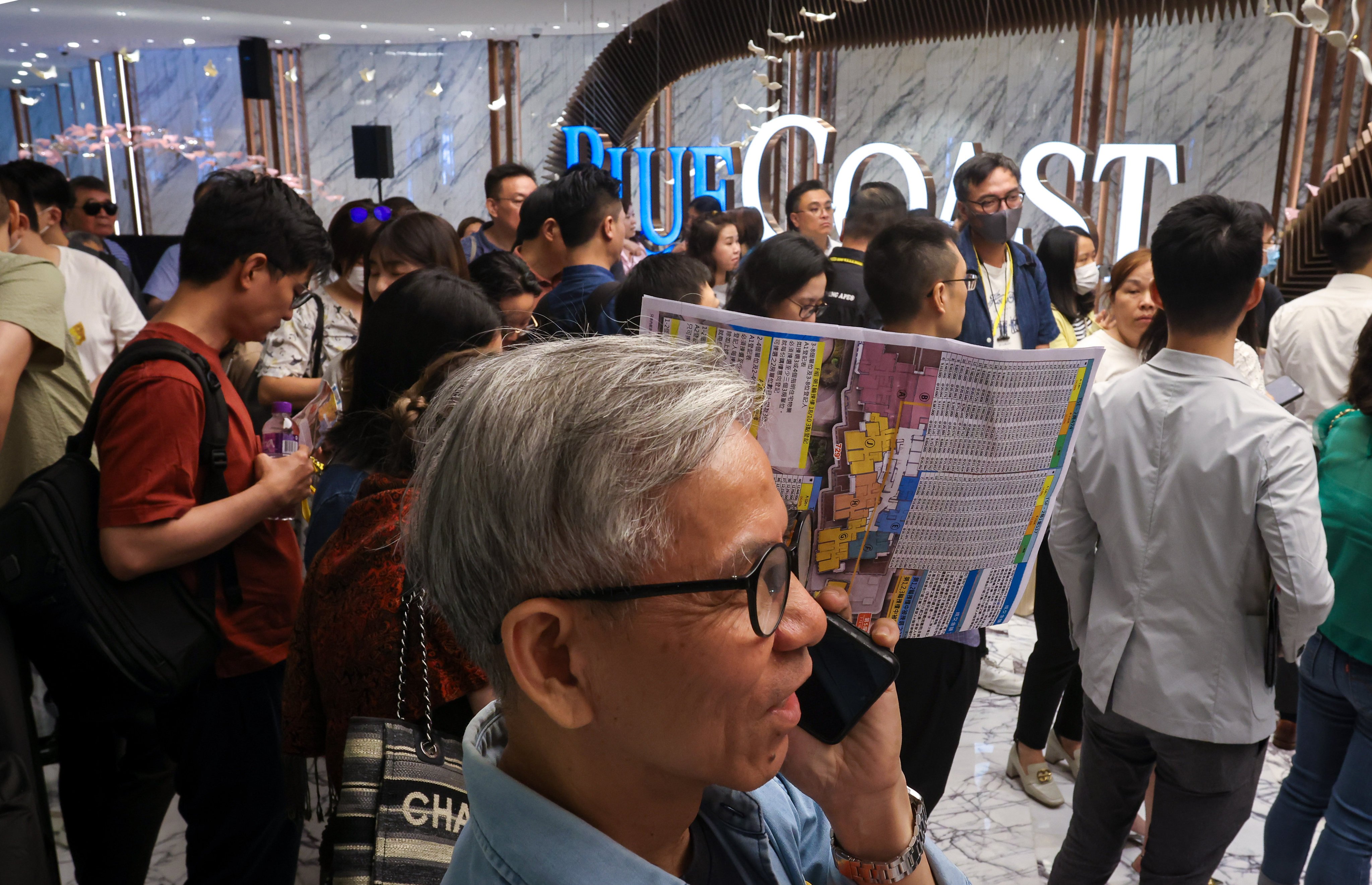 Homebuyers queued for the Blue Coast ll apartments at Fortune Metropolis in Hung Hom on 19 October 2024. Photo: Jonathan Wong