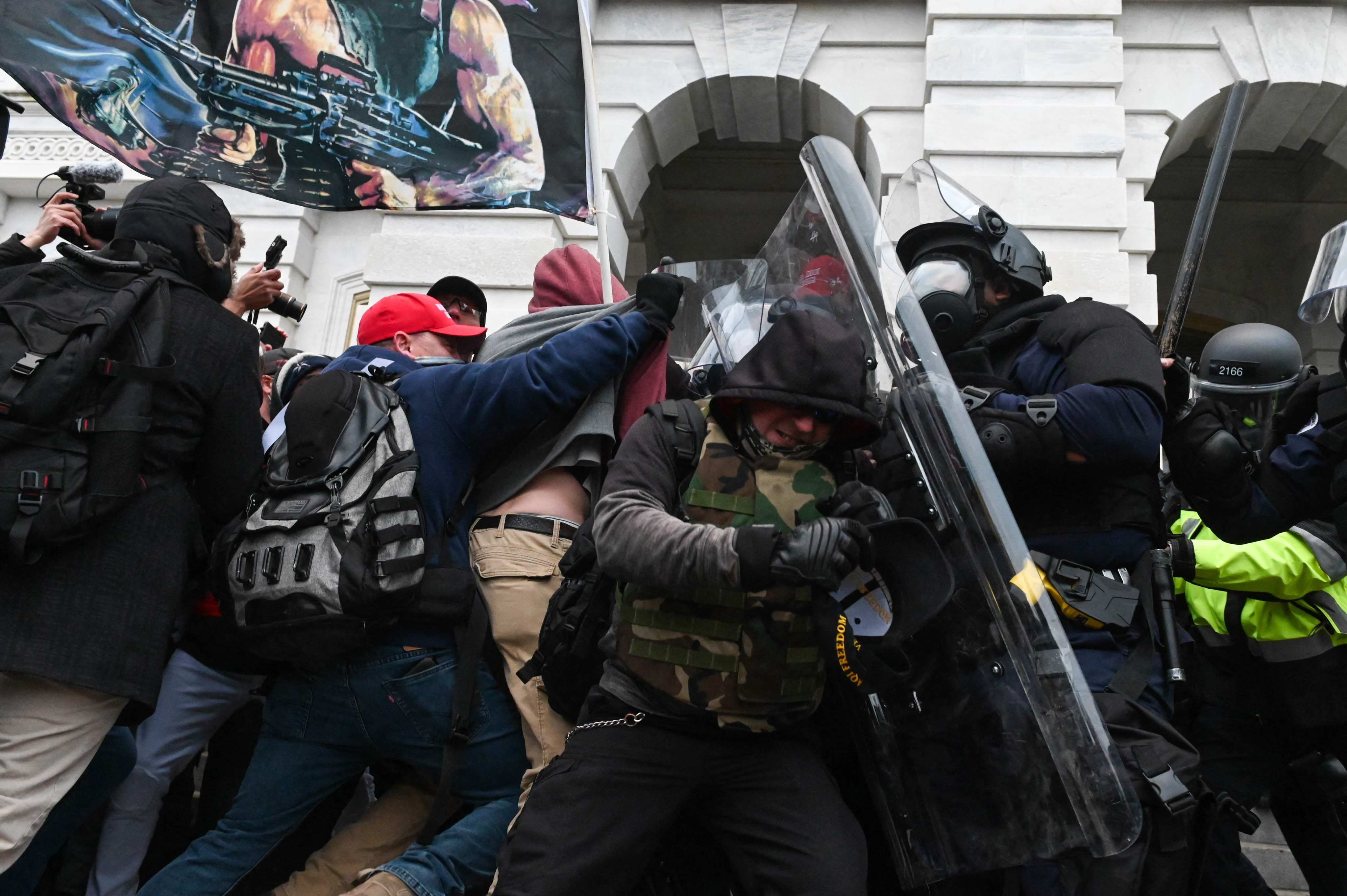 Riot police push back a crowd of supporters of US President Donald Trump after they stormed the US Capitol on January 6, 2021 in Washington, DC.  Photo: AFP