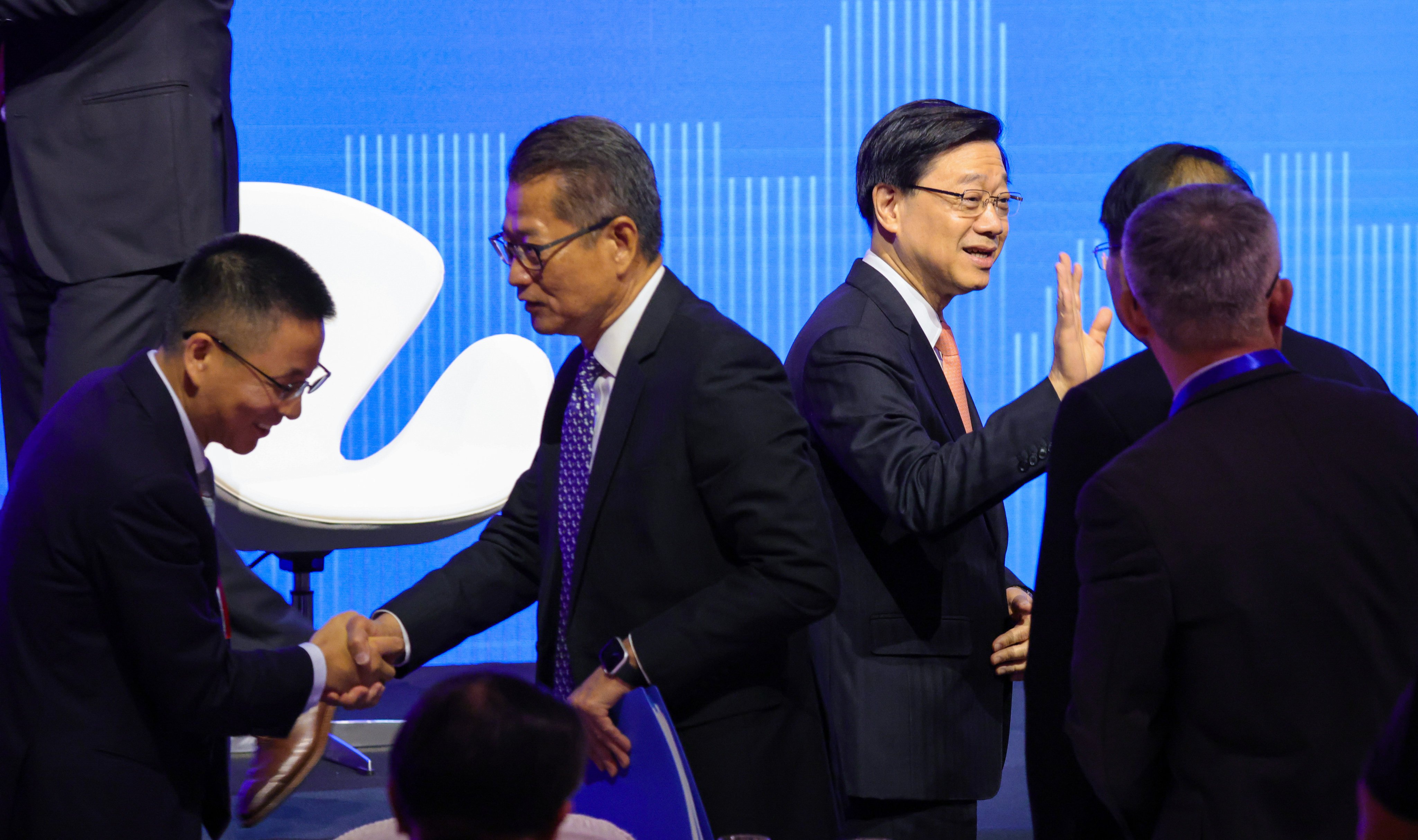 Chief Executive of Hong Kong SAR John Lee Ka-chiu (right) and Financial Secretary Paul Chan Mo-po during the second Global Financial Leaders’ Investment Summit at the Four Seasons Hotel in Central on 7 November 2023. Photo: May Tse.