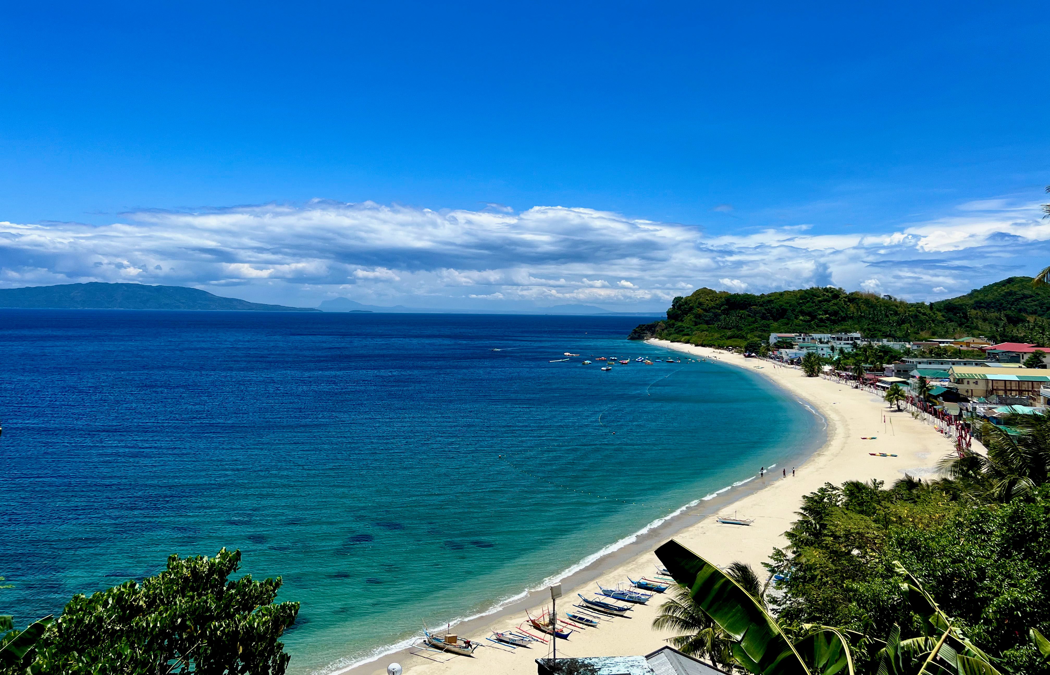 White Beach, by far the most popular of Puerto Galera’s many beaches with both local and overseas visitors. Its white sands pristine waters enchant by day and its vibrant nightlife entertainment by night. Photo: Terry Duckham