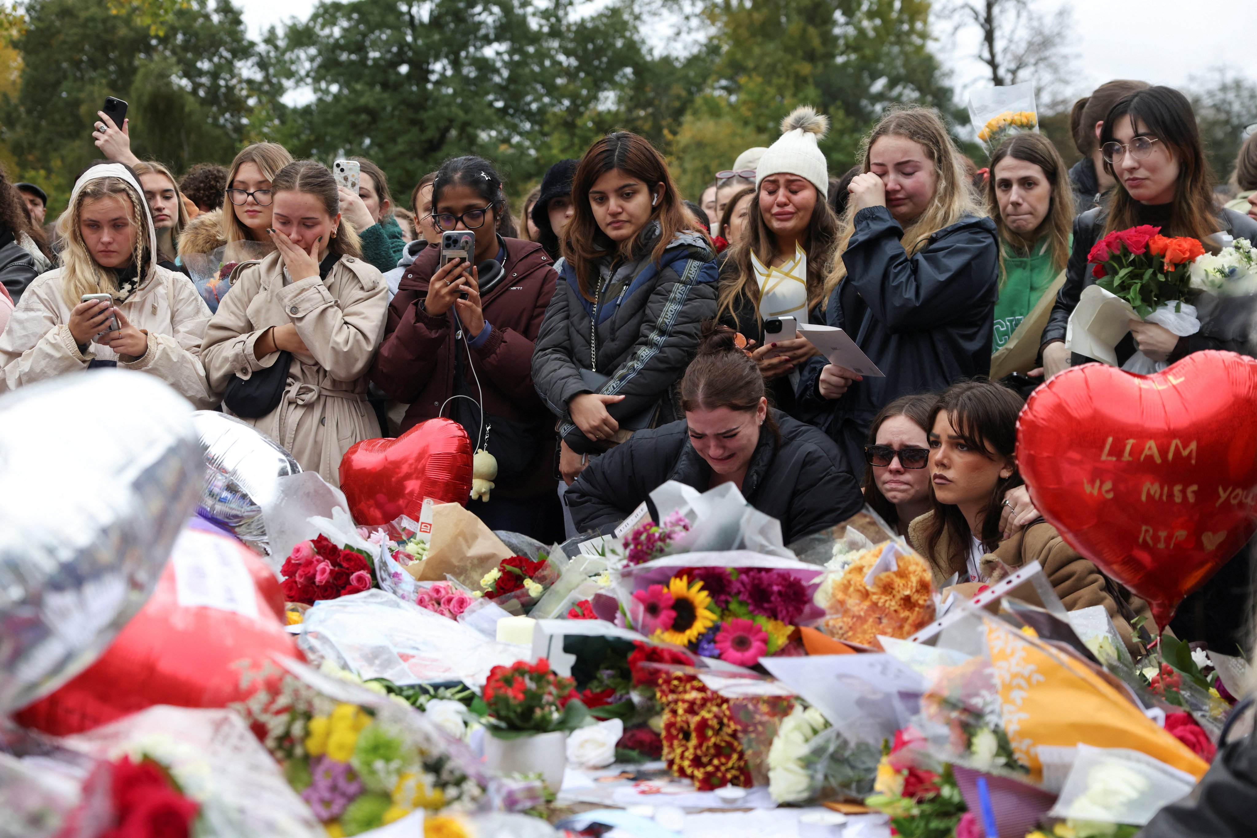 Fans pay tribute to former One Direction singer Liam Payne, in Hyde Park, London. Photo: Reuters