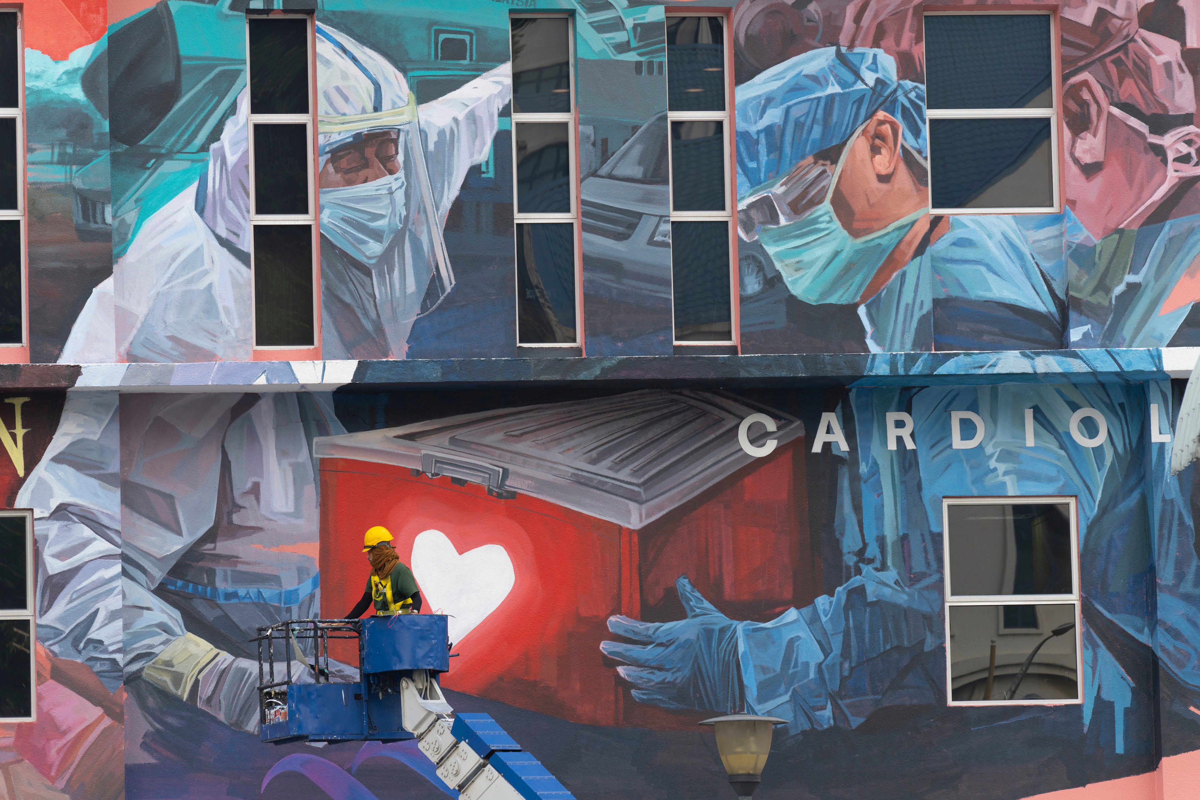 A giant mural tribute outside a hospital in Kuala Lumpur, Malaysia. Photo: AP