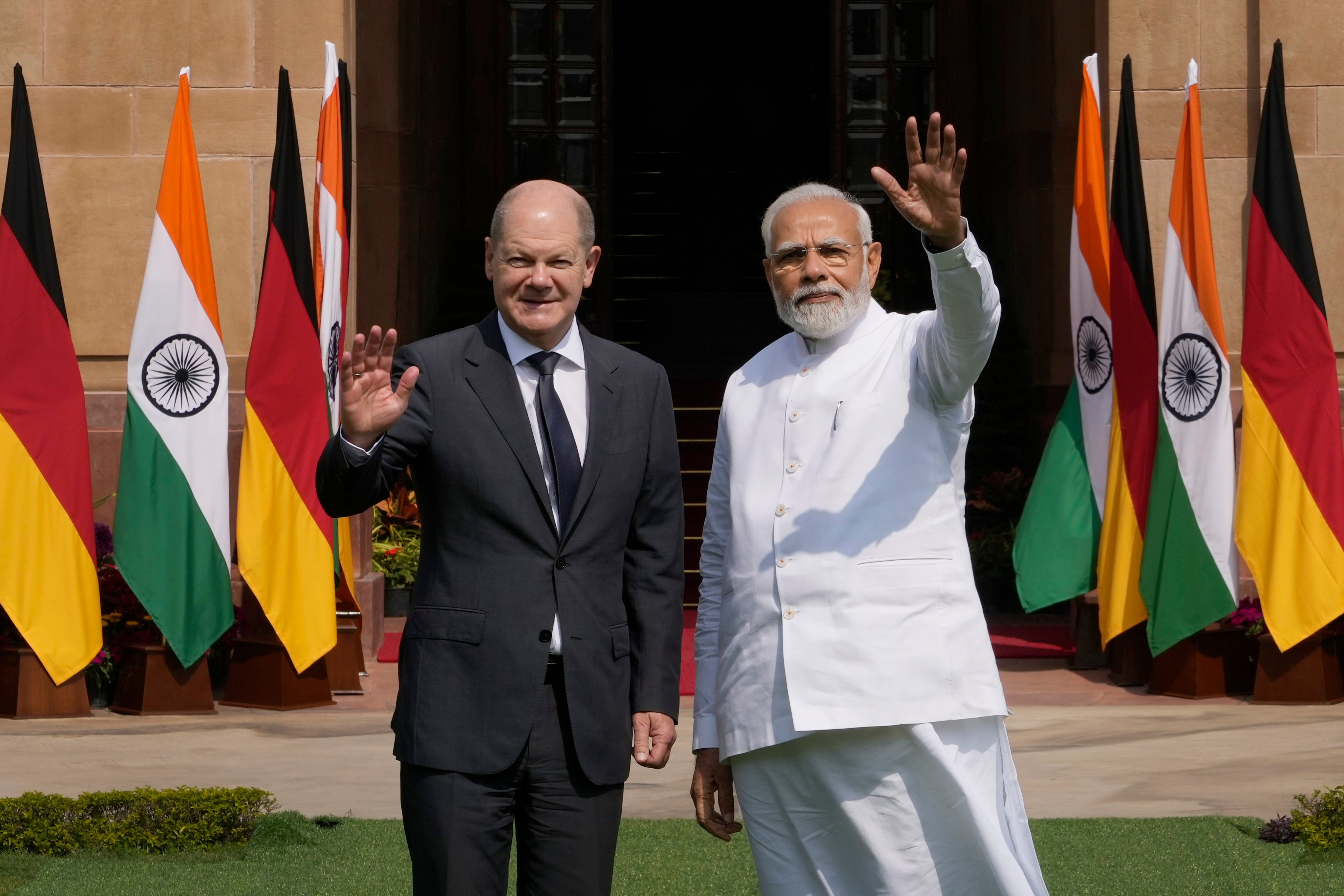 German Chancellor Olaf Scholz and Indian Prime Minister Narendra Modi wave to media before their meeting in New Delhi in February 2023. Photo: AP