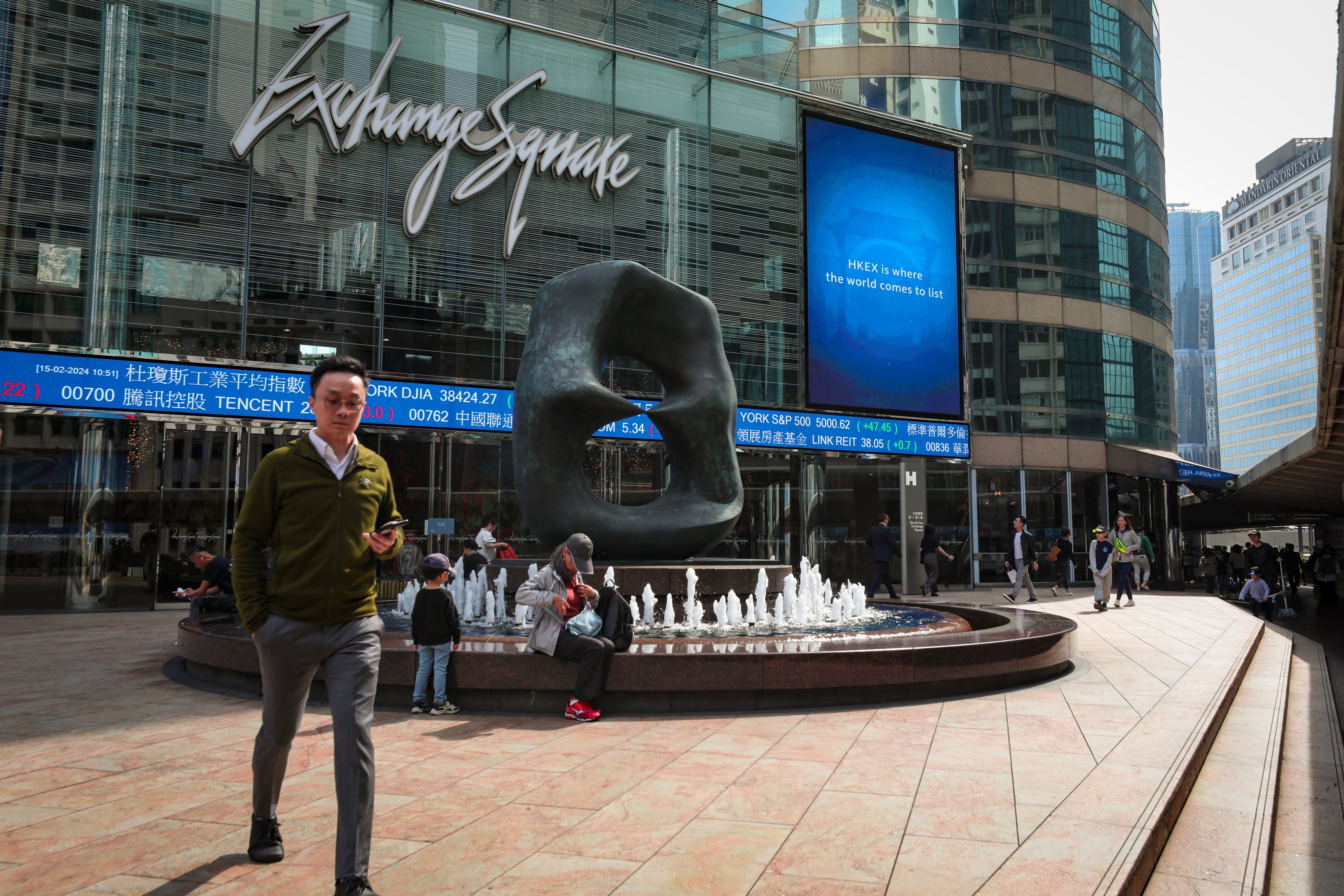 People enjoy a sunny day in Exchange Square, home of the city’s bourse operator, on February 15, 2024. Photo: Sun Yeung