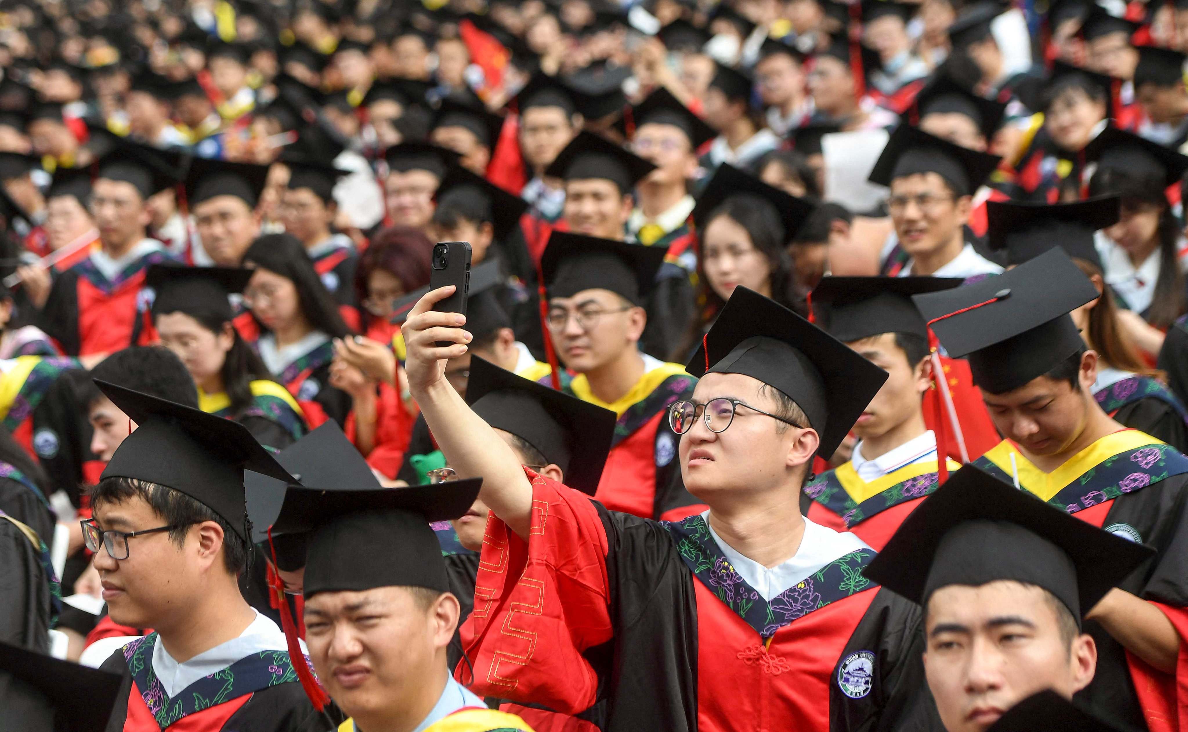 China has reported a record-high 11.79 million college graduates this year, most of whom entered the job market this summer. Photo: AFP