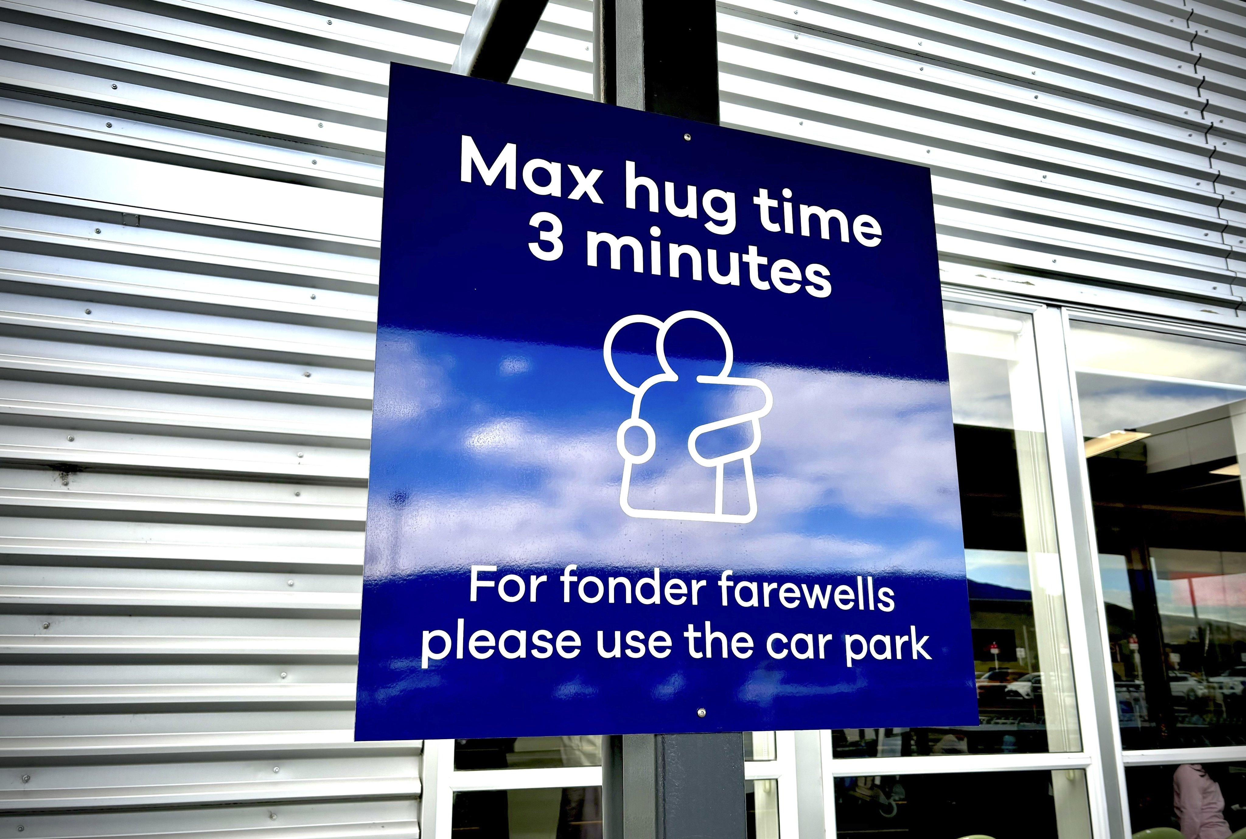 A sign informing time limits for visitors to the passenger drop-off area outside Dunedin Airport. Photo: Dunedin Airport via AP