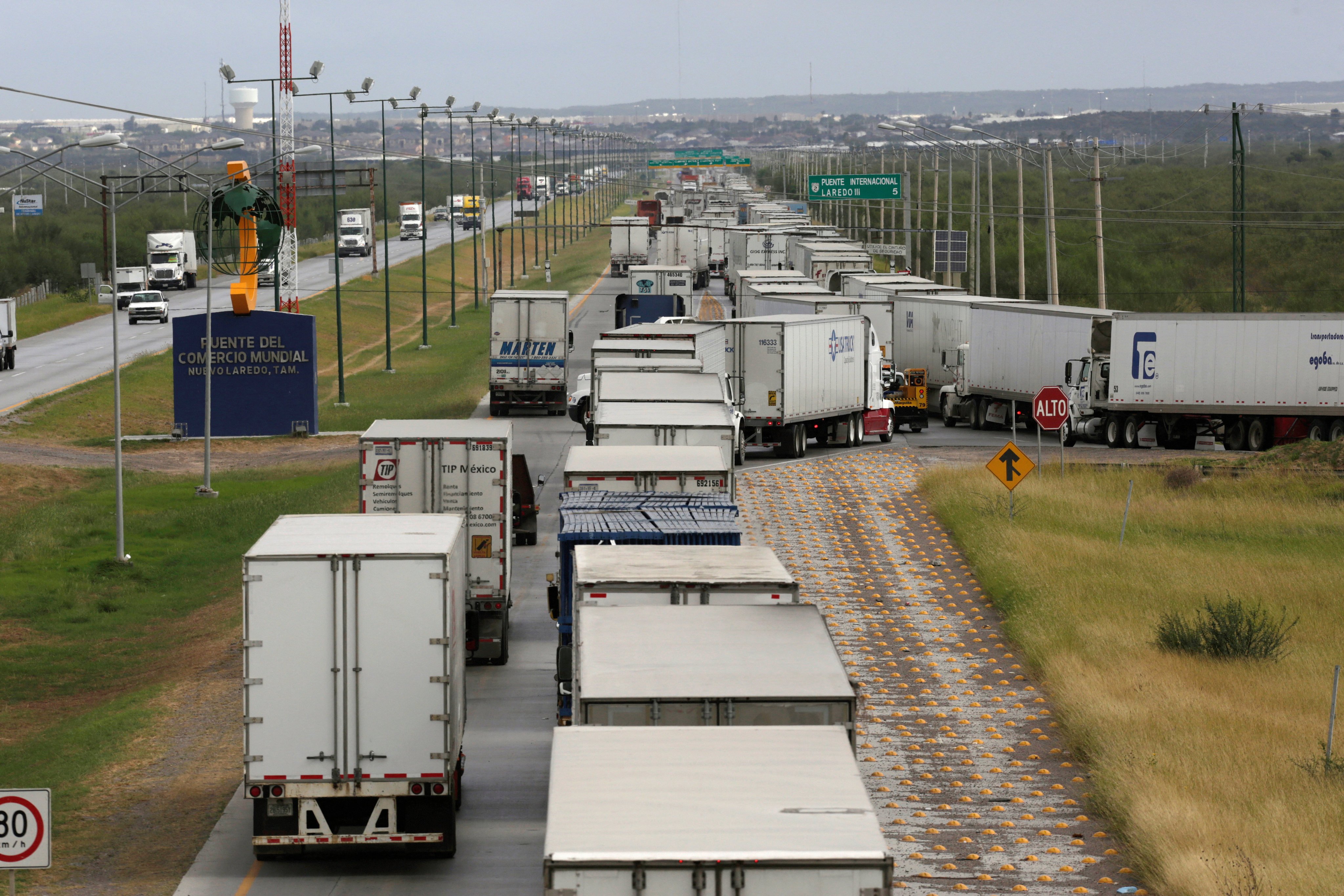 Trucks wait in a long queue for border customs control to cross into US at the World Trade Bridge in Nuevo Laredo, Mexico. Photo: Reuters