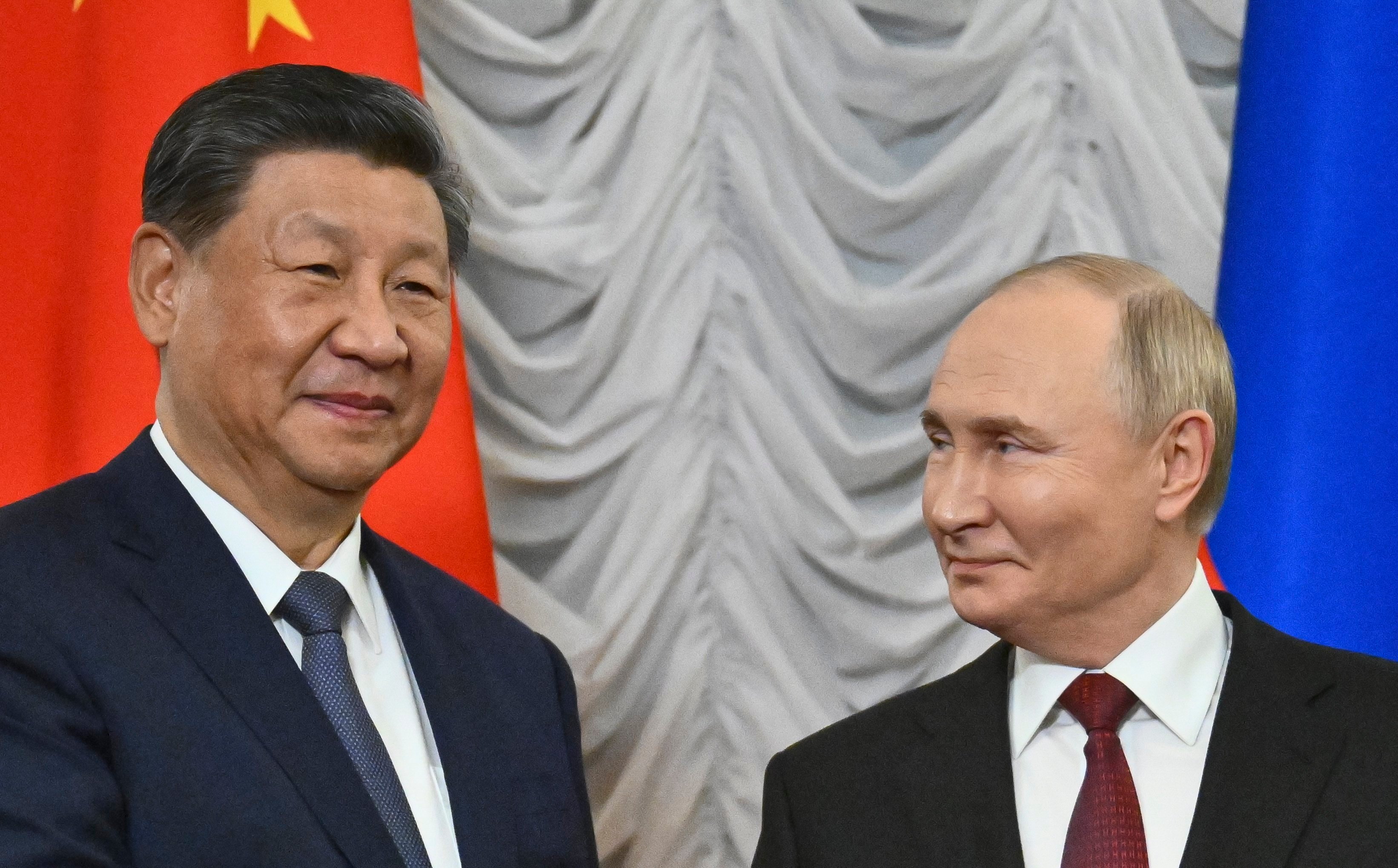 Russian President Vladimir Putin (right) welcomes Chinese President Xi Jinping during their meeting on the sidelines of the Brics summit in Kazan, Russia, on Tuesday. Photo: EPA-EFE