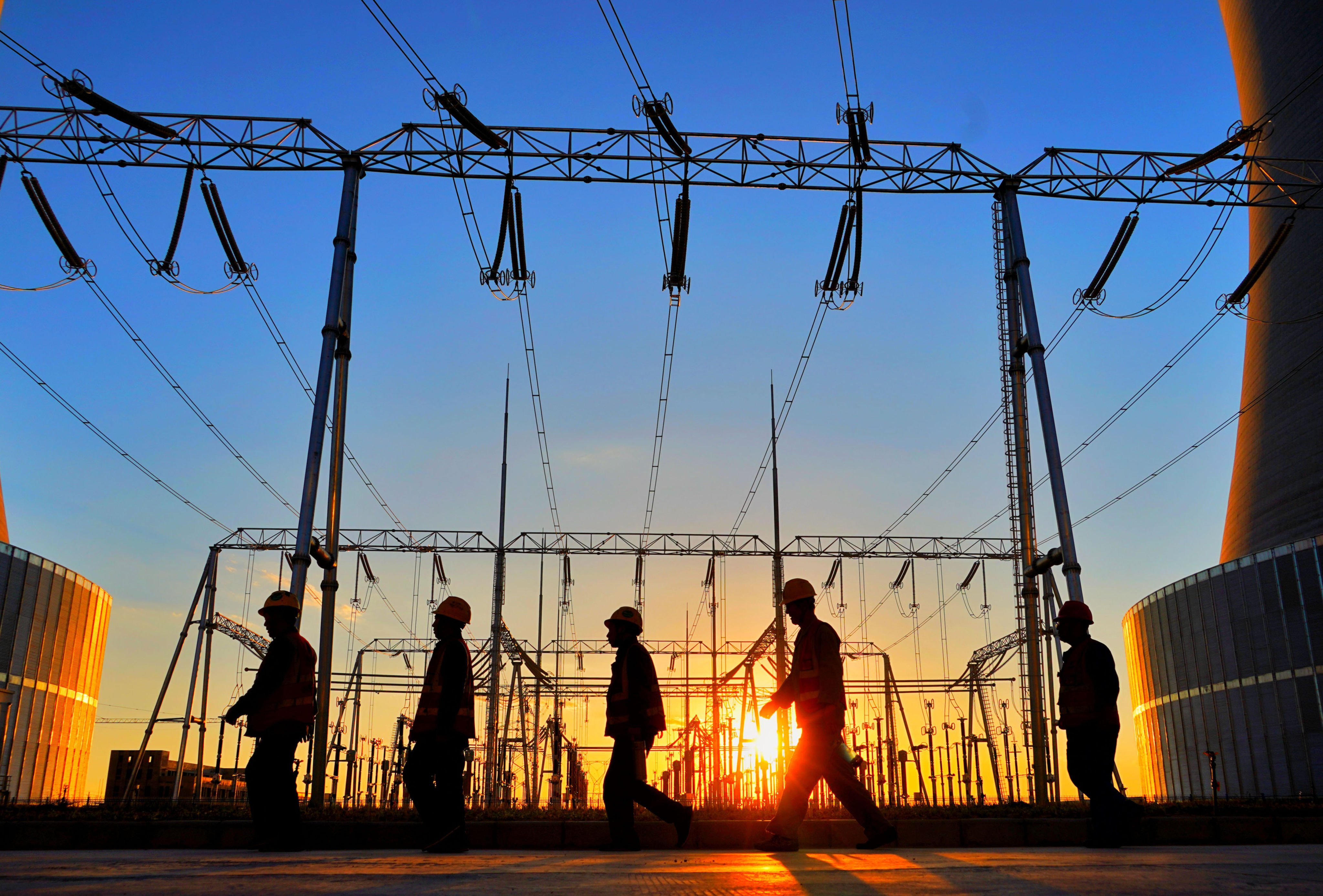 Workers walk in a power plant in the Shanghaimiao economic development zone in Otogqian Banner, north China’s Inner Mongolia Autonomous Region. Photo: Xinhua