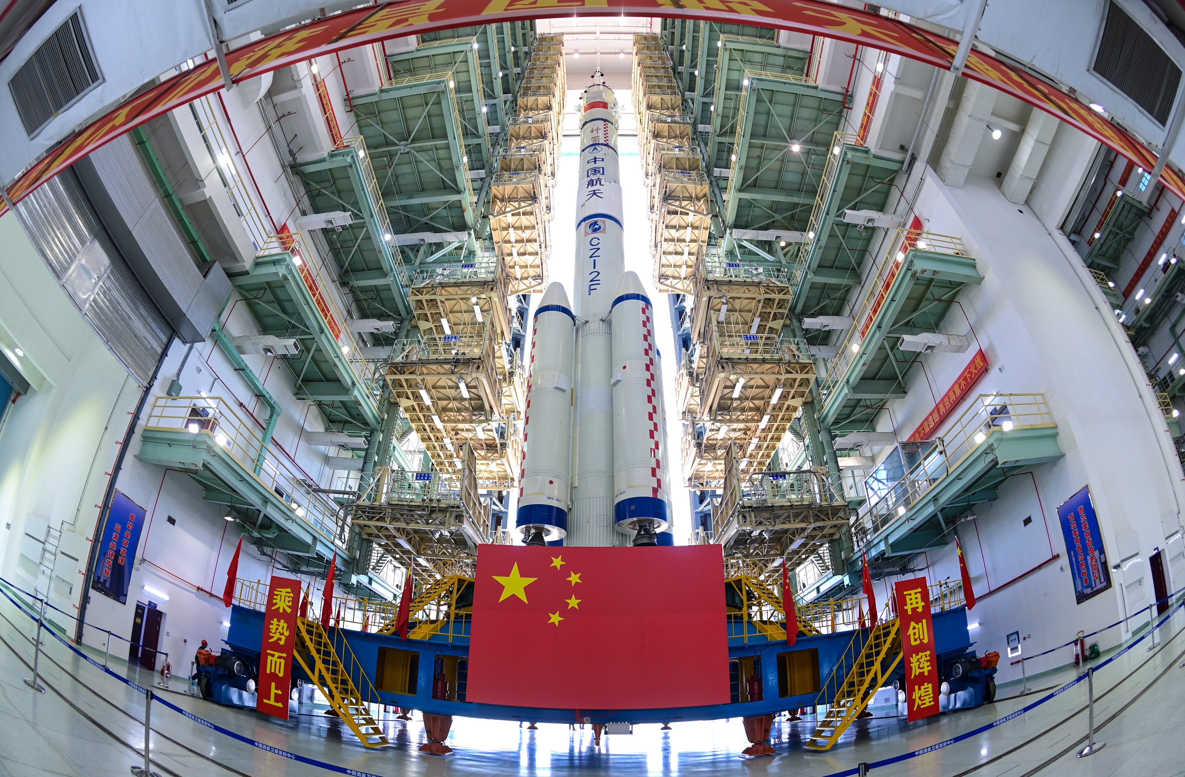 A Shenzhou-19 spaceship and a Long March-2F carrier rocket are transferred to a launch platform on Tuesday. Photo: Xinhua