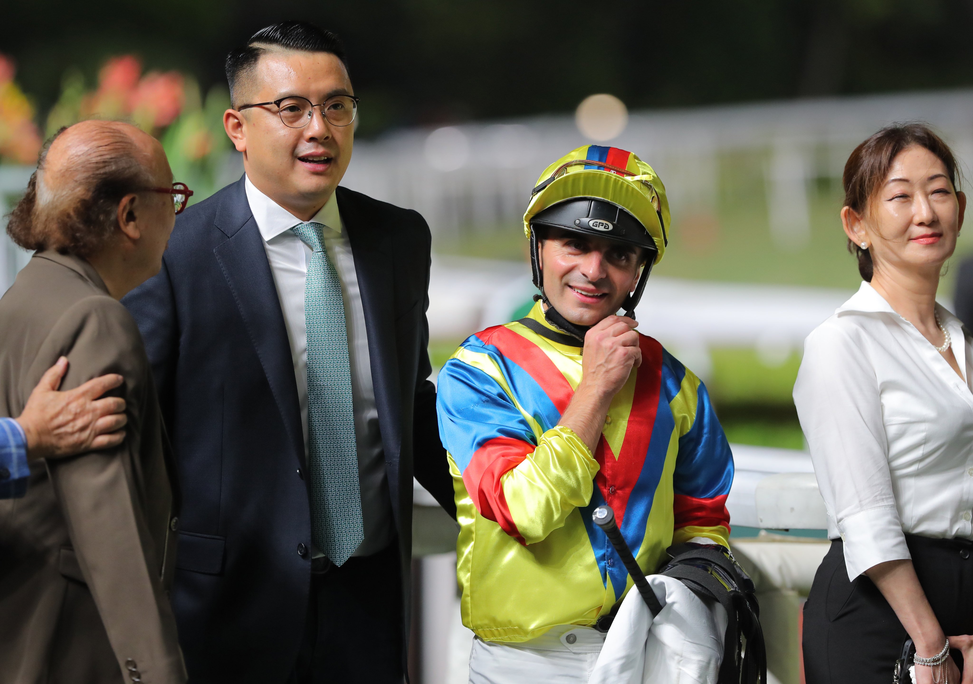 Pierre Ng celebrates with jockey Andrea Atzeni and connections of Robot Knight. Photos: Kenneth Chan