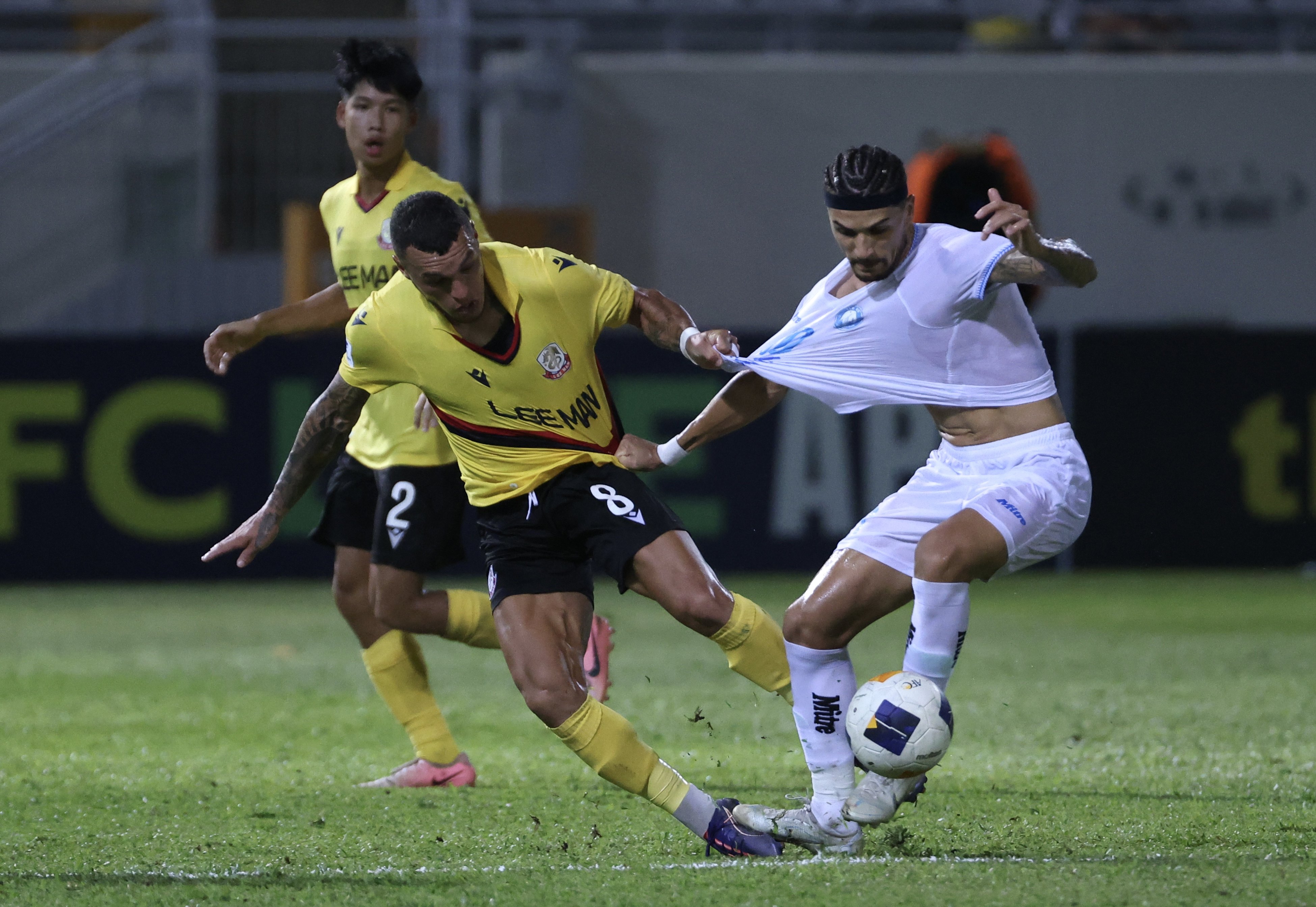 Lee Man’s Everton Camargo is fended off during the home loss to Nam Dinh. Photo: Jonathan Wong