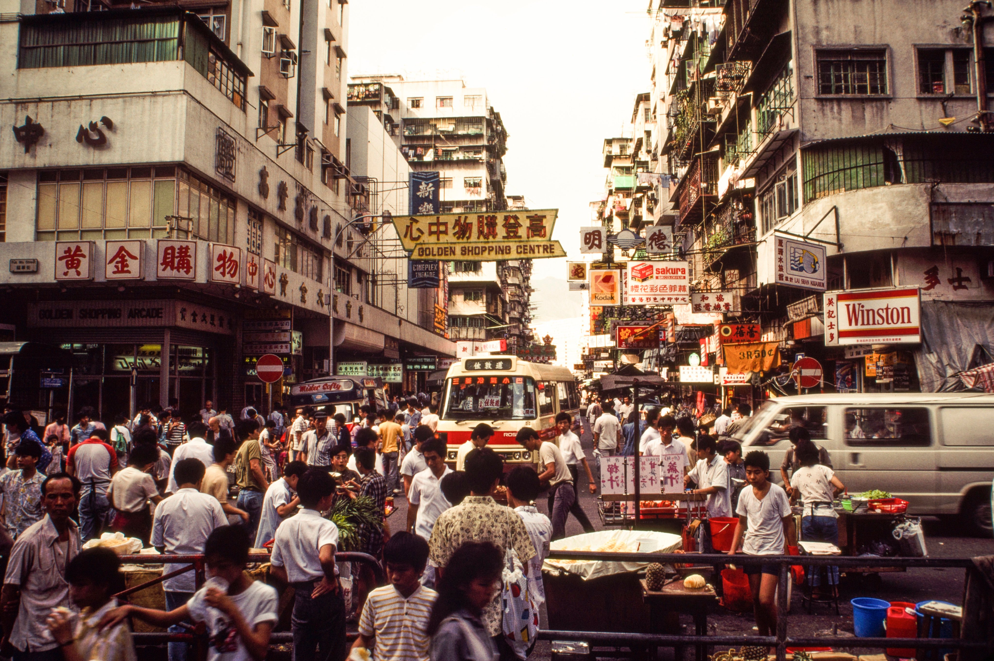 A view of pedestrian and vehicle traffic in a shopping district in Sham Shui Po in Hong Kong, in 1986. Photo: Getty Images