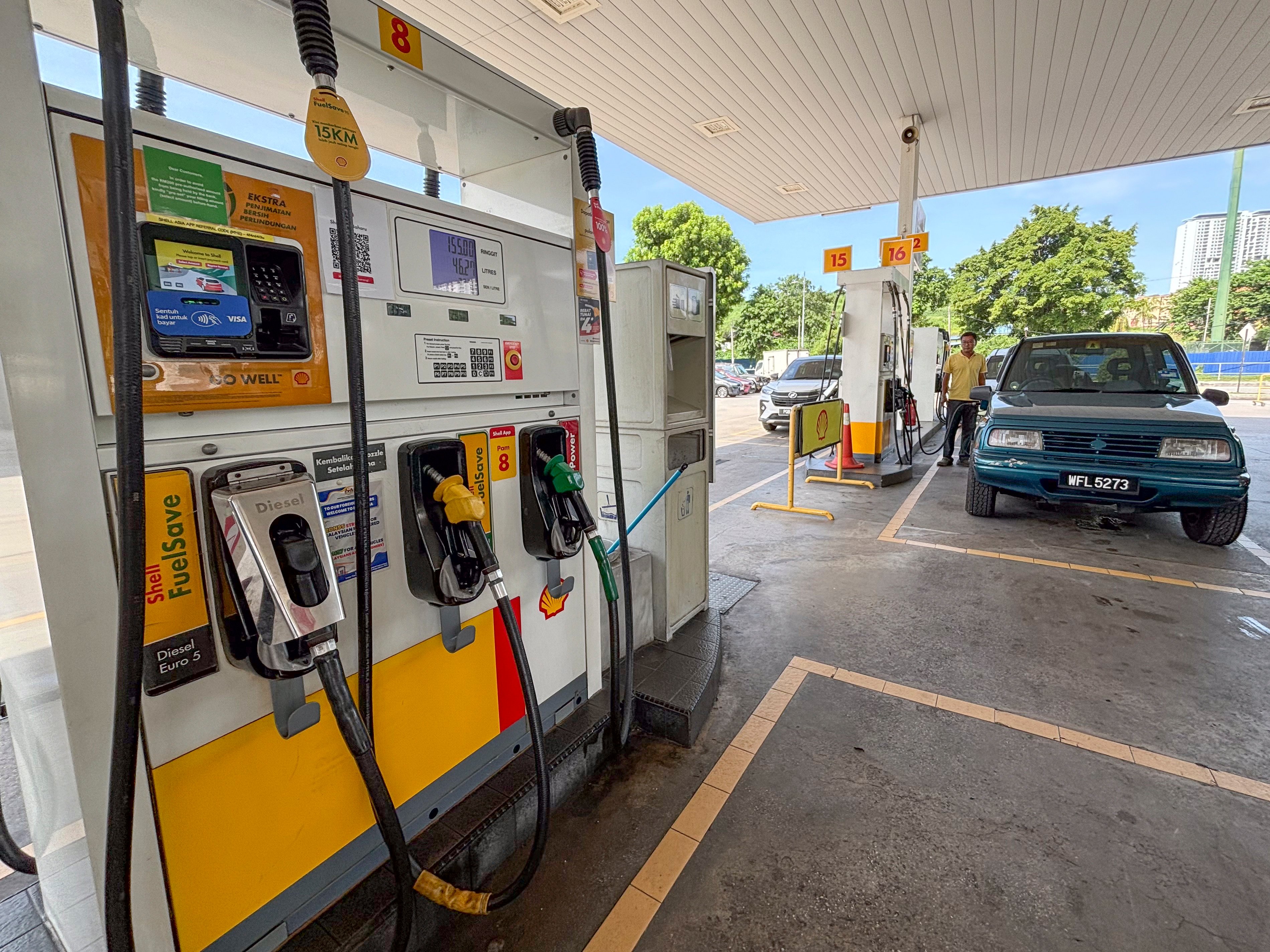 A car owner pumps at a petrol station in Kuala Lumpur, Malaysia. Anwar and his administration have faced public resentment over painful subsidy cuts to electricity, certain food items and, most recently, diesel. Photo: AP