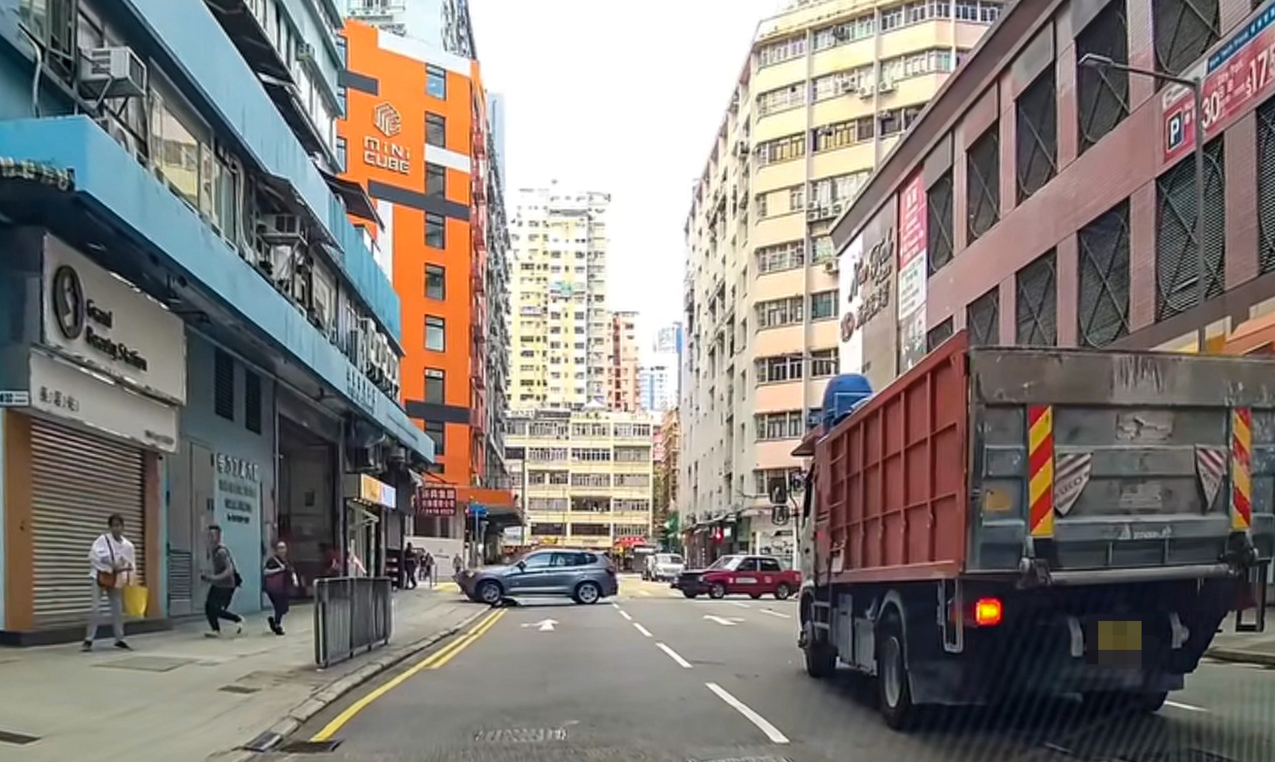 A BMW car has crashed into a truck and a taxi on Wednesday. Photo: Facebook/Terry Kwan