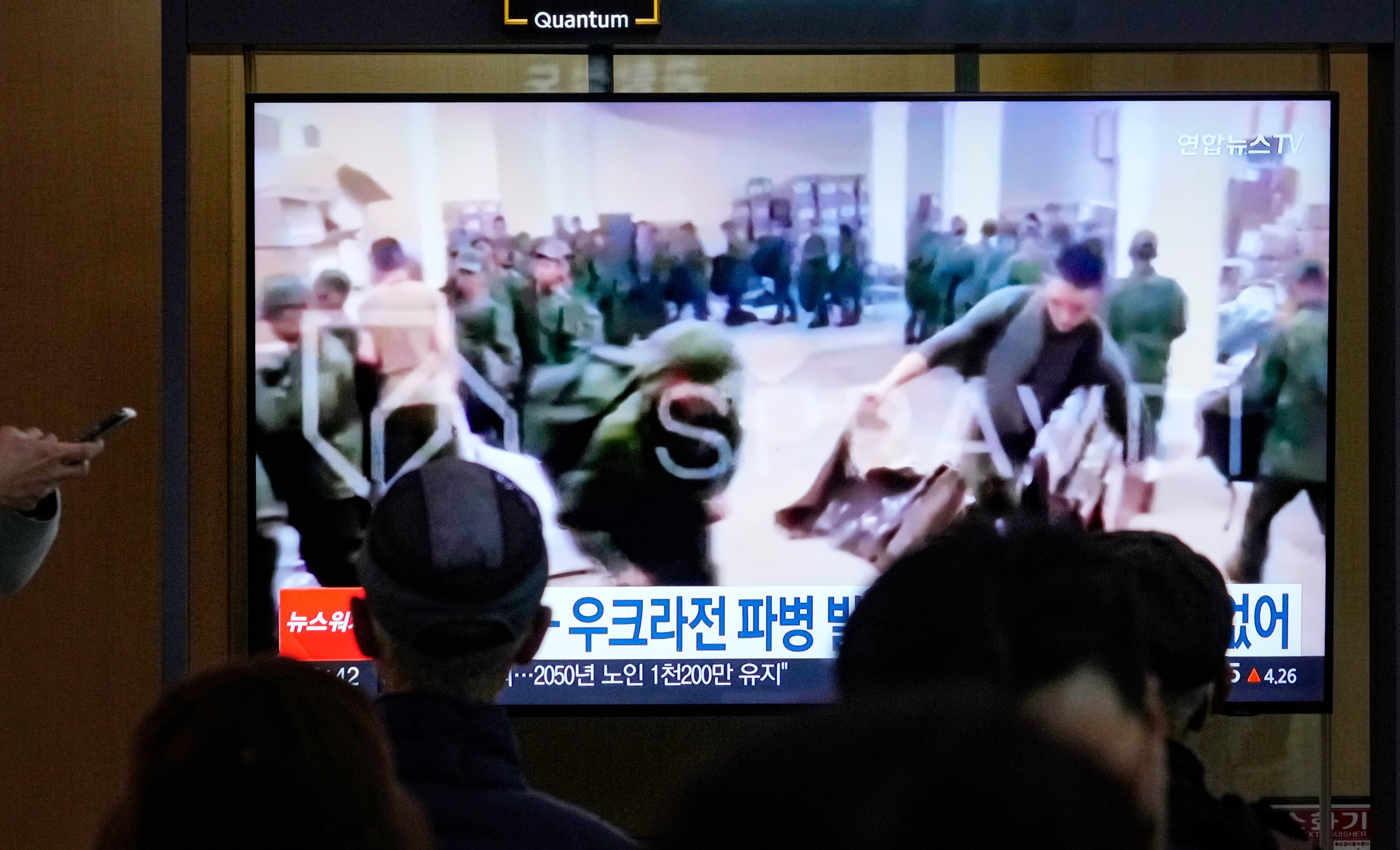 A TV screen at a Seoul railway station broadcast an image on Monday of soldiers, believed to be from North Korea, receiving supplies in Russia. Photo: AP