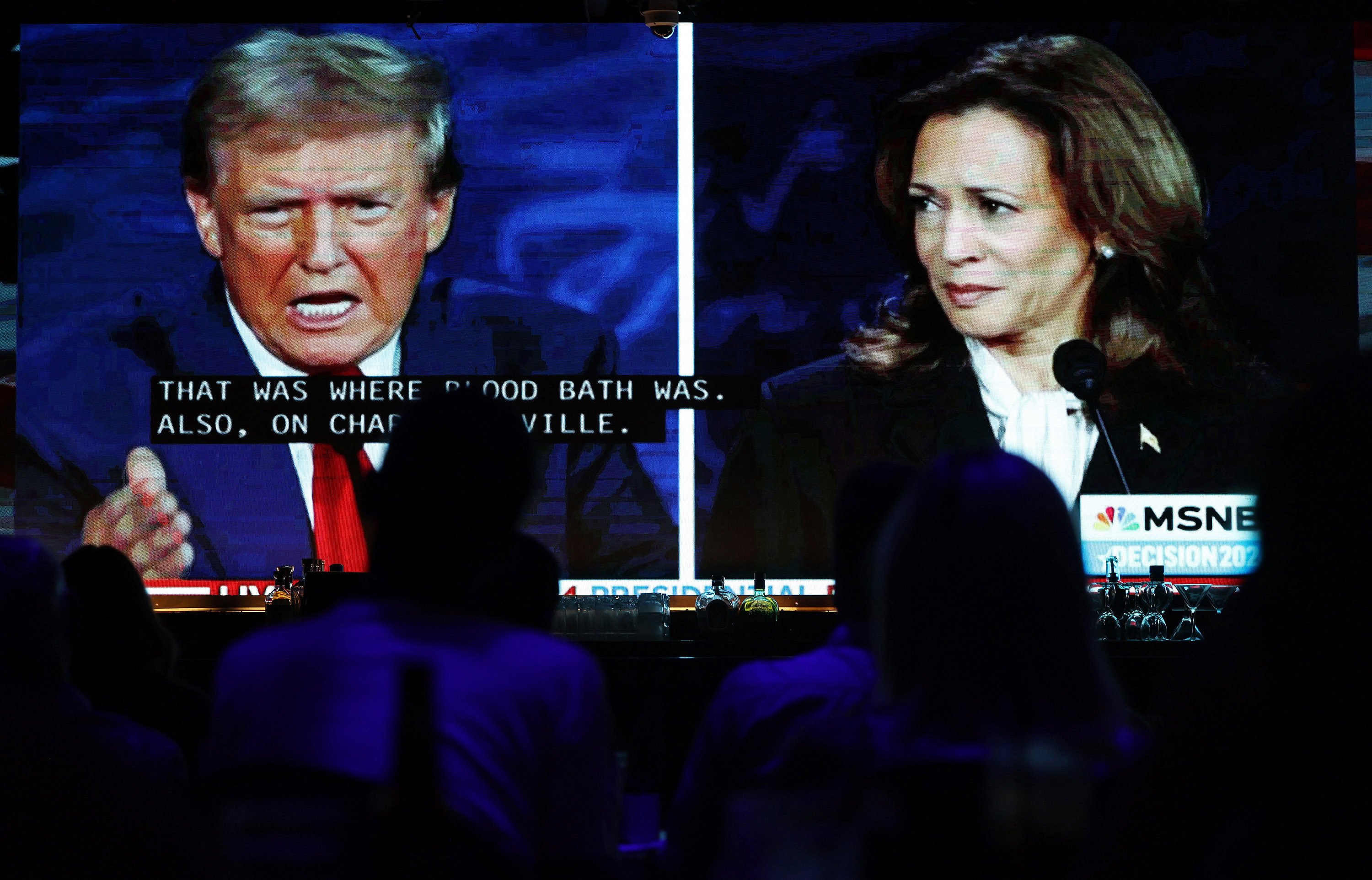 People watch the ABC News presidential debate between Democratic presidential nominee, US Vice President Kamala Harris, and Republican presidential nominee, former US president Donald Trump, at a watch party in West Hollywood, California, on September 10. Photo: Getty Images/TNS