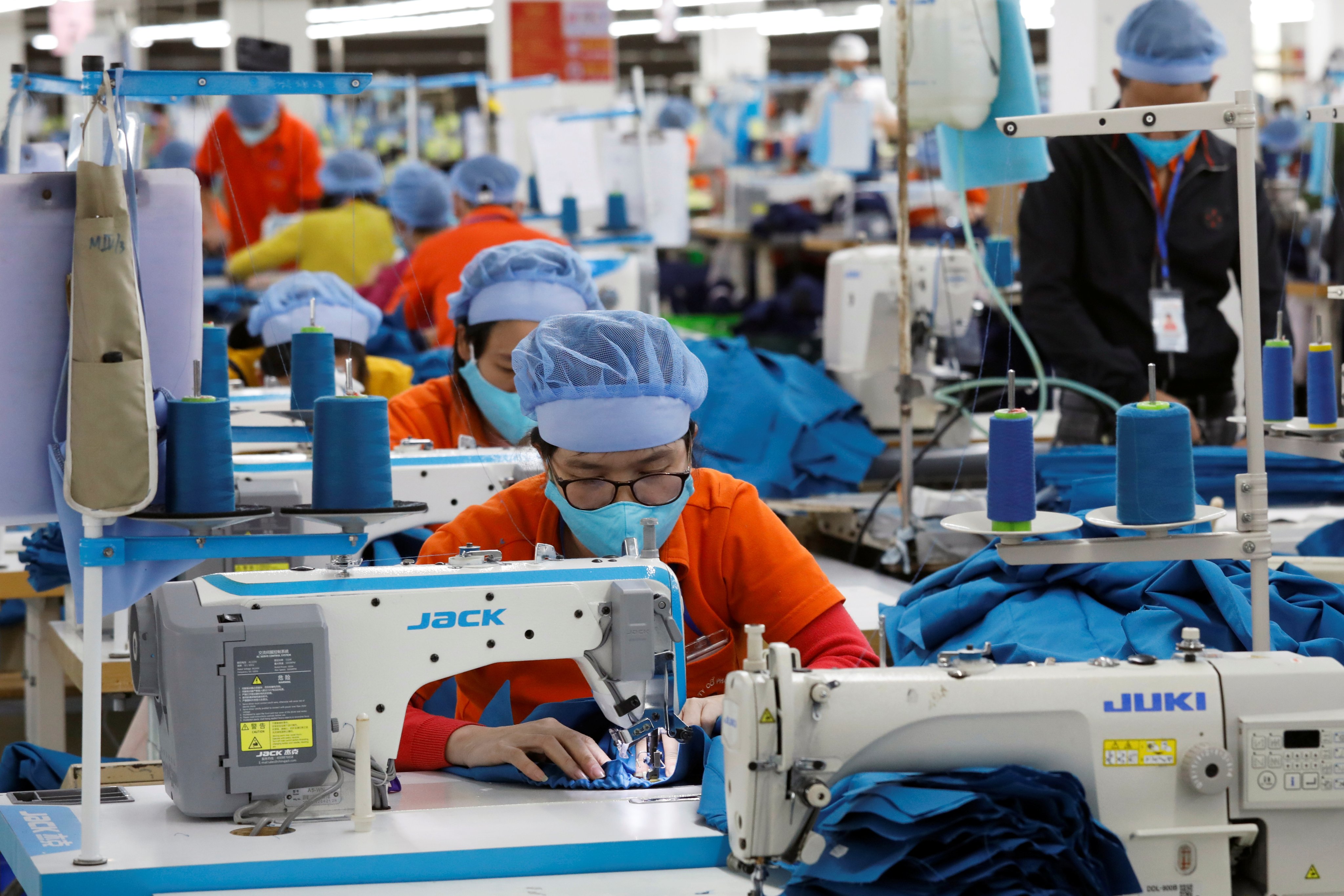 Employees work at a garment export factory in Hung Yen province, Vietnam, in December 2020. For many smaller firms, securing supply-chain finance from local banks is a significant challenge. Photo: Reuters