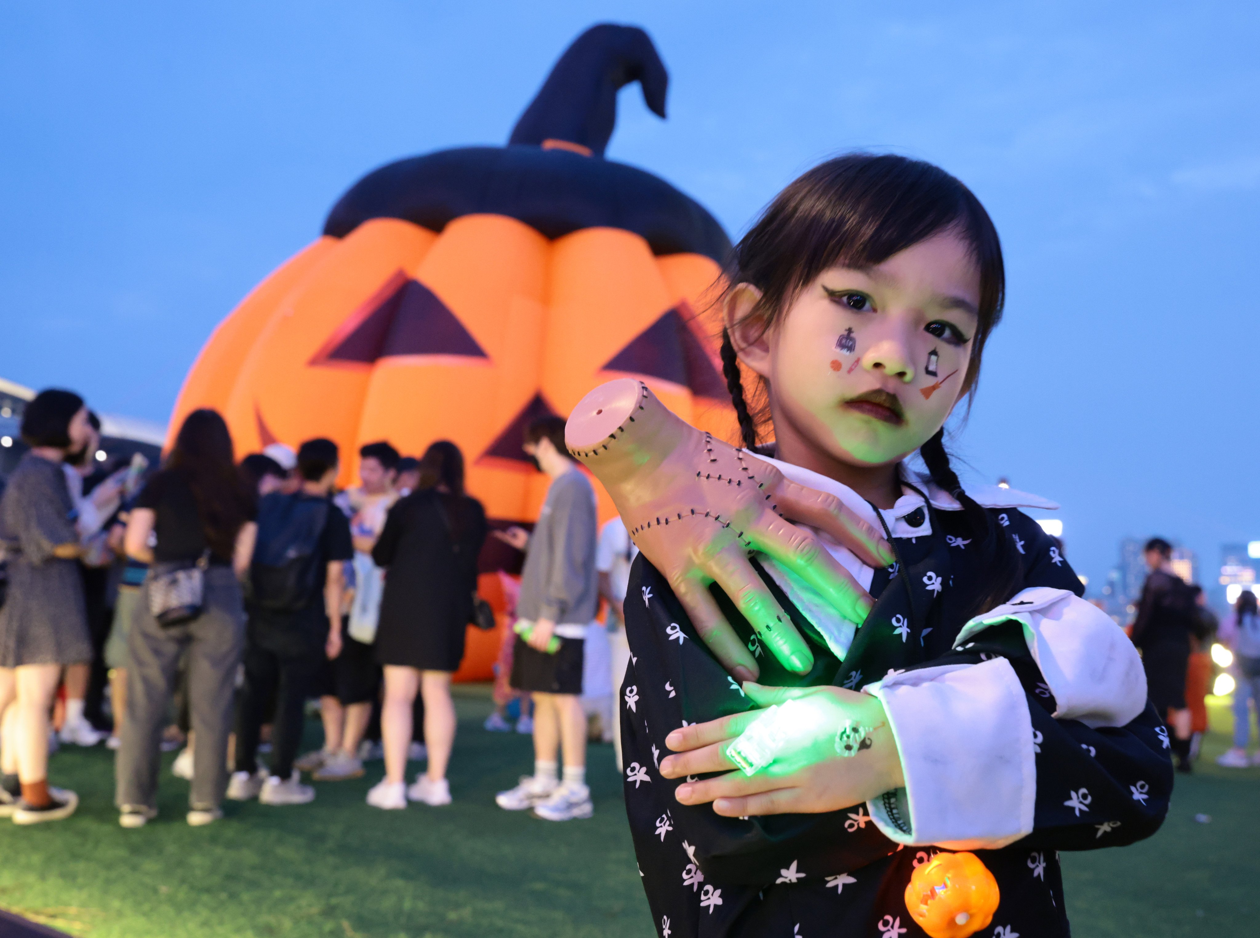 Studies confirm that seeing masked faces, hearing screams, and watching parades of people dressed as ghosts or corpses during Halloween can genuinely terrify children and can lead to lasting phobias. Photo: May Tse