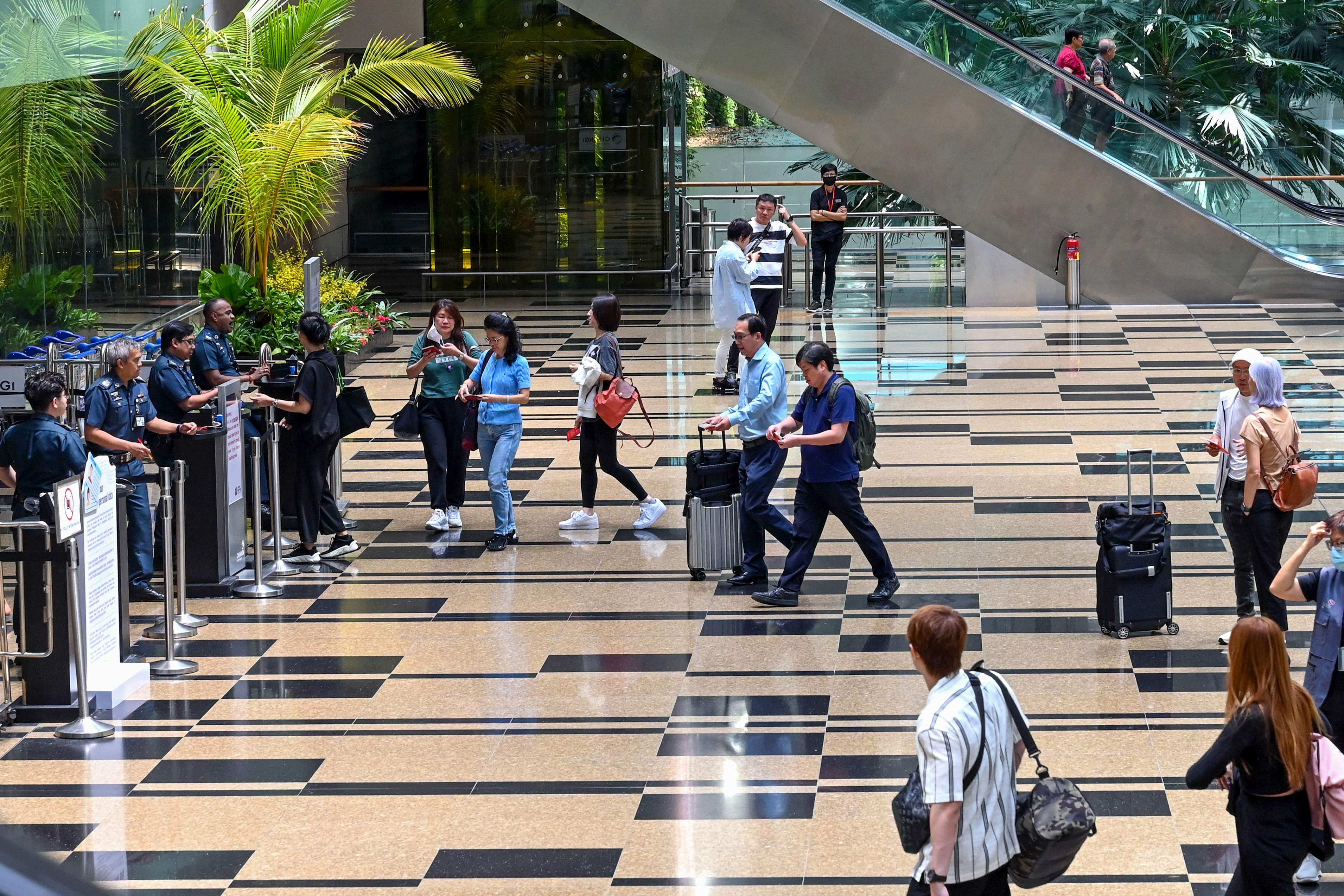 Singapore airport’s passport-less immigration system has reduced clearance time by 60 per cent. Photo: AFP
