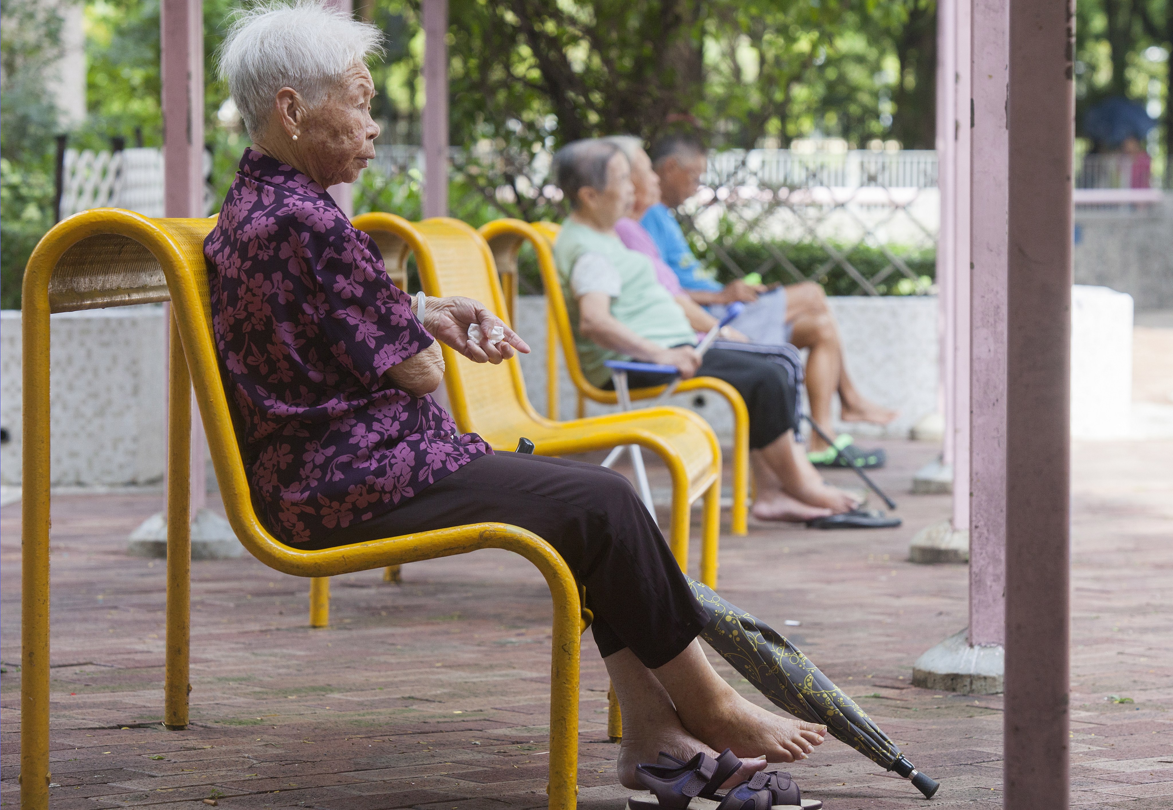 Elderly residents gather outside at a public housing estate in Tseung Kwan O in 2018. Photo: EPA-EFE