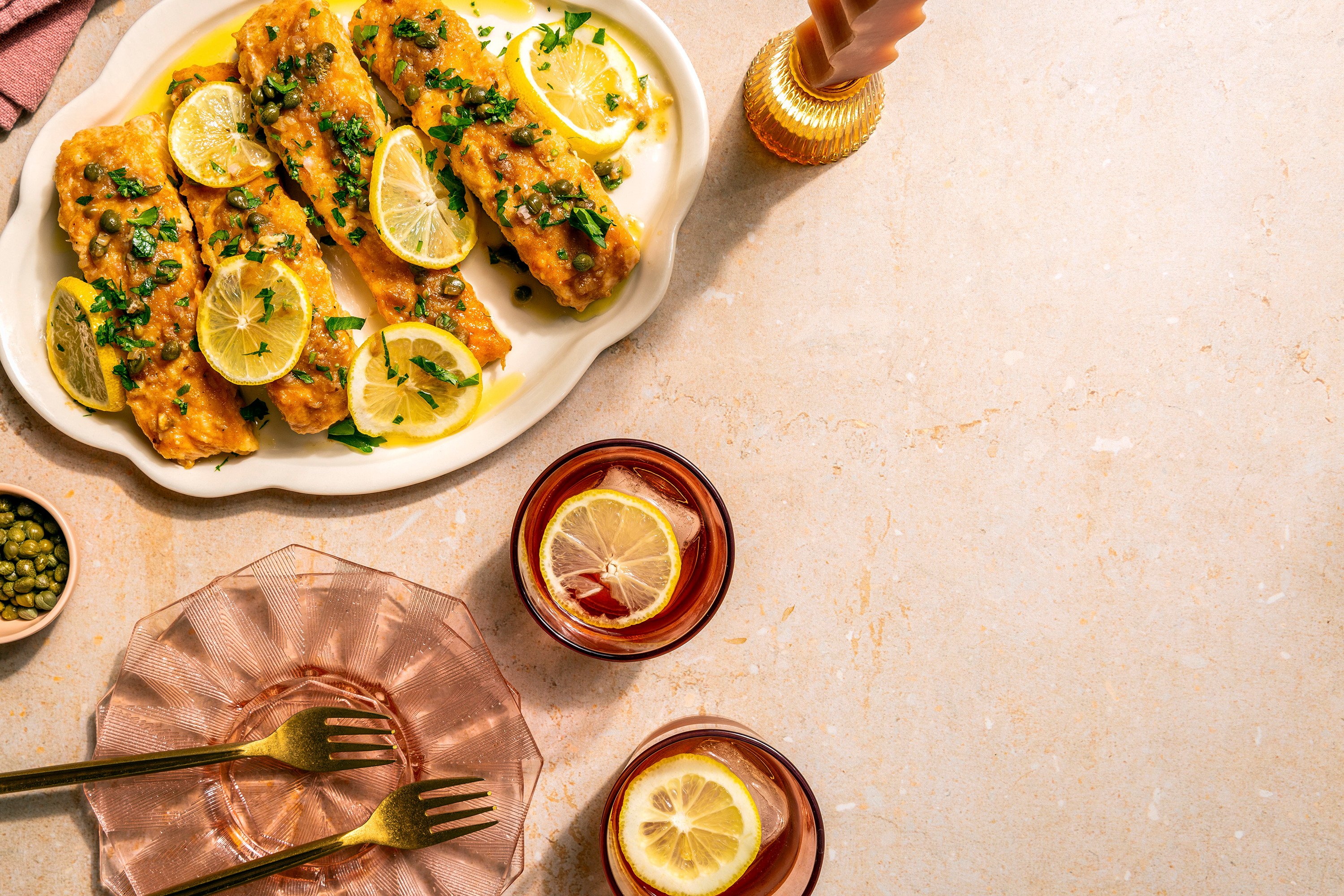 A recipe for salmon piccata in A Couple Cooks: 100 Recipes to Cook Together, in which married food bloggers Sonja and Alex Overhiser take the heat out of sharing the kitchen and promote “bonding moments”. Photo: Chronicle Books via AP