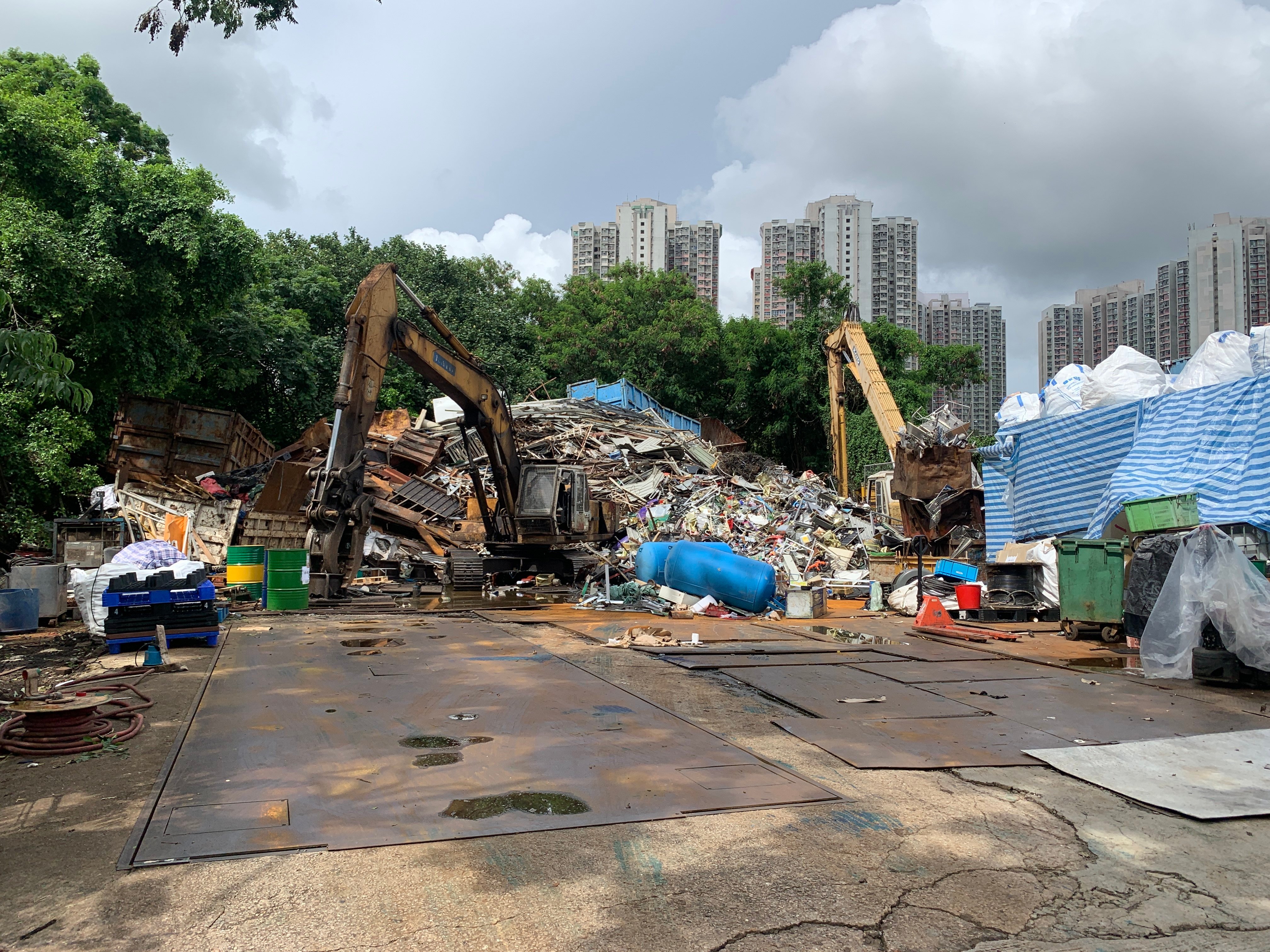 The Planning Department handed over a case after initially looking into suspicions a private plot and its adjacent government land had been turned into an illegal storage facility. Photo Handout