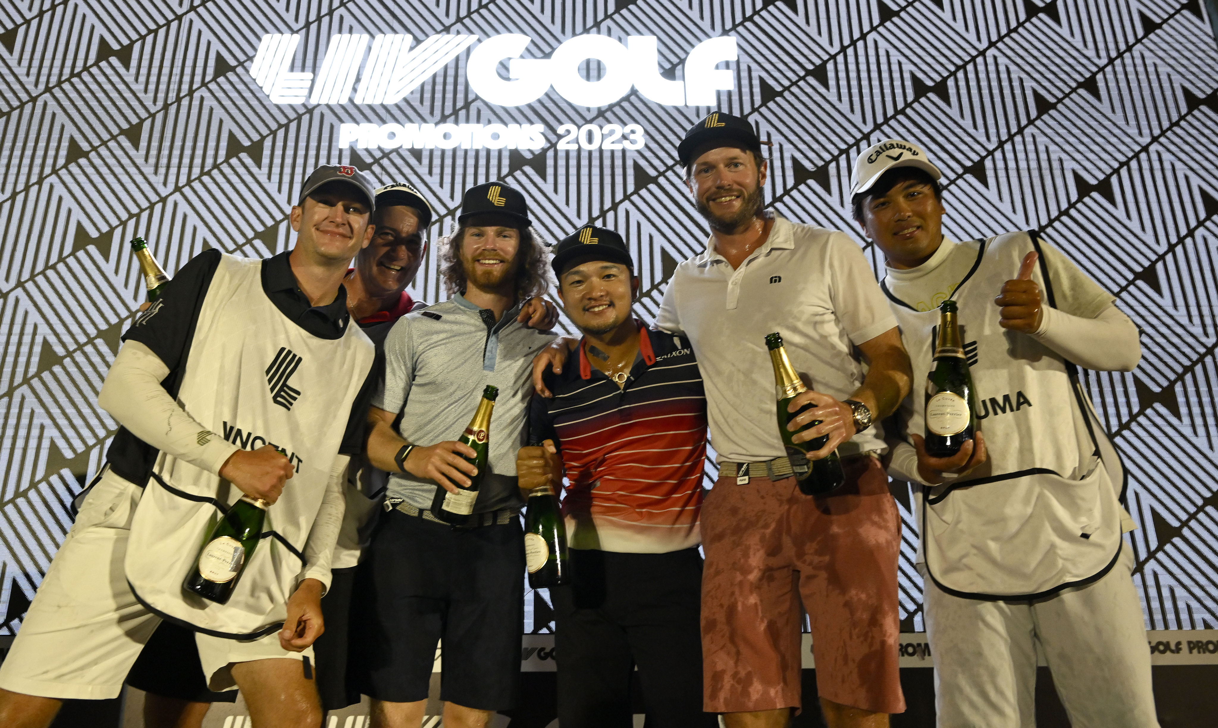 Kieran Vincent of Zimbabwe (third left) Jinchiro Kozuma and Kalle Samooja celebrate after the LIV Golf Promotions event at Abu Dhabi Golf Club. Photo: Asian Tour