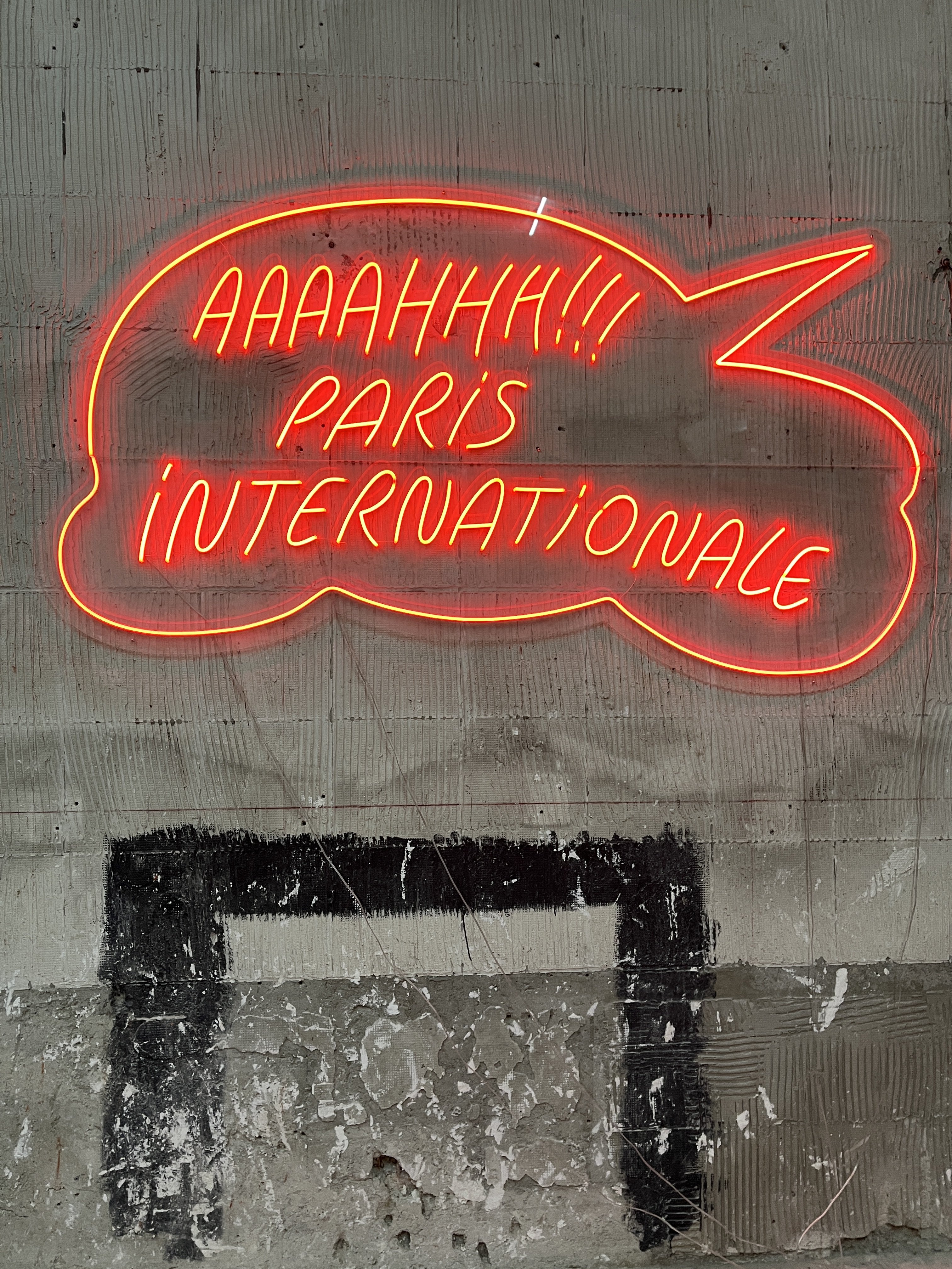 A neon sign for Paris Internationale at the art fair’s entrance. Photo: Enid Tsui