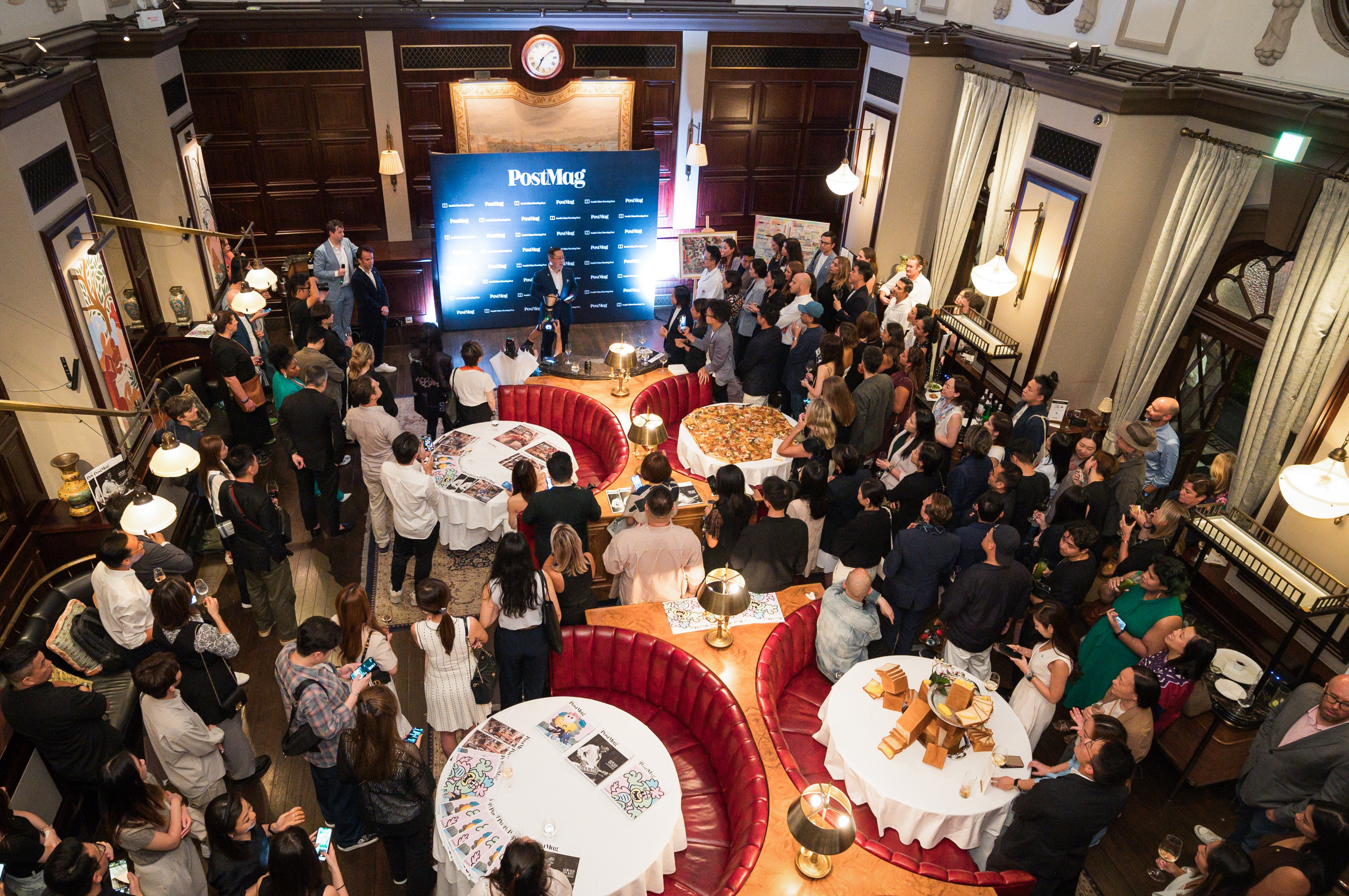 Guests gathered around the former courtroom of The Magistracy in Hong Kong, celebrating the launch of PostMag. Photo: SCMP