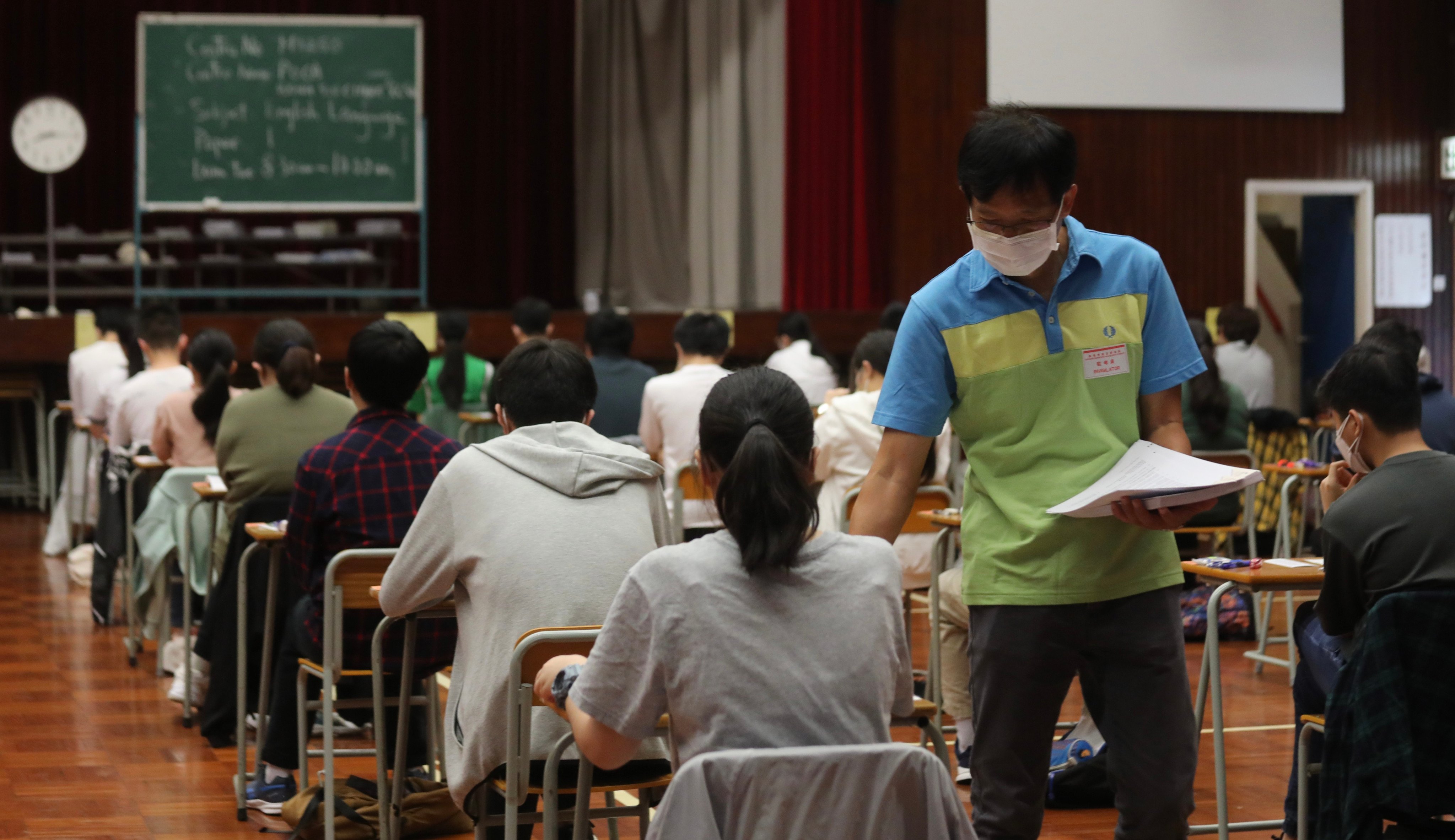 Students sit for the Diploma of Secondary Education (HKDSE) English examination. Some mainland Chinese people are accused of exploiting various talent schemes for their children to enjoy cheaper tuition fees. Photo: Xiaomei Chen