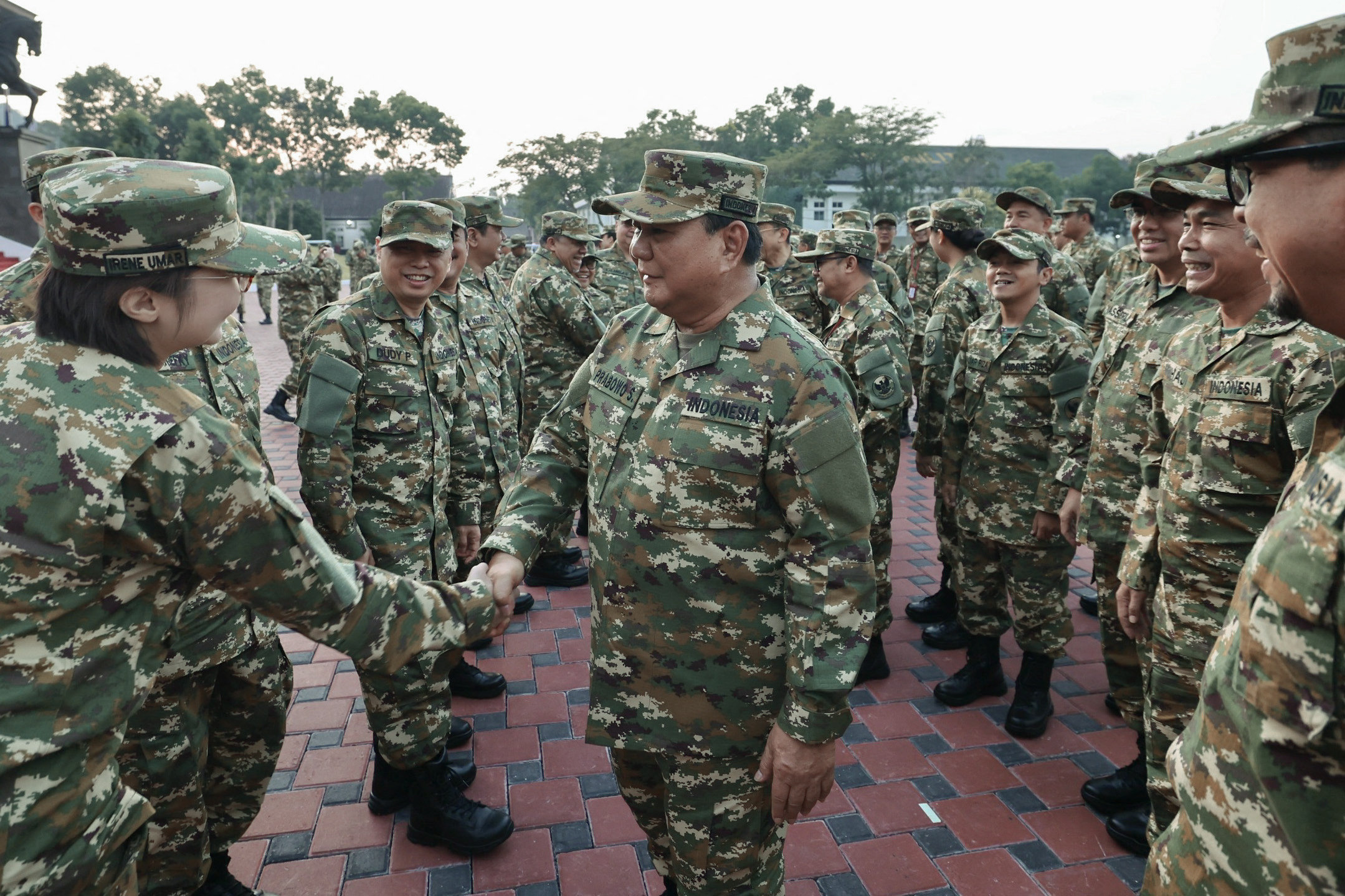 Indonesia’s President Prabowo Subianto shakes hands with a cadet at the military academy in Magelang, Central Java, on Friday. Photo: Media partner of Gerindra Party/AFP
