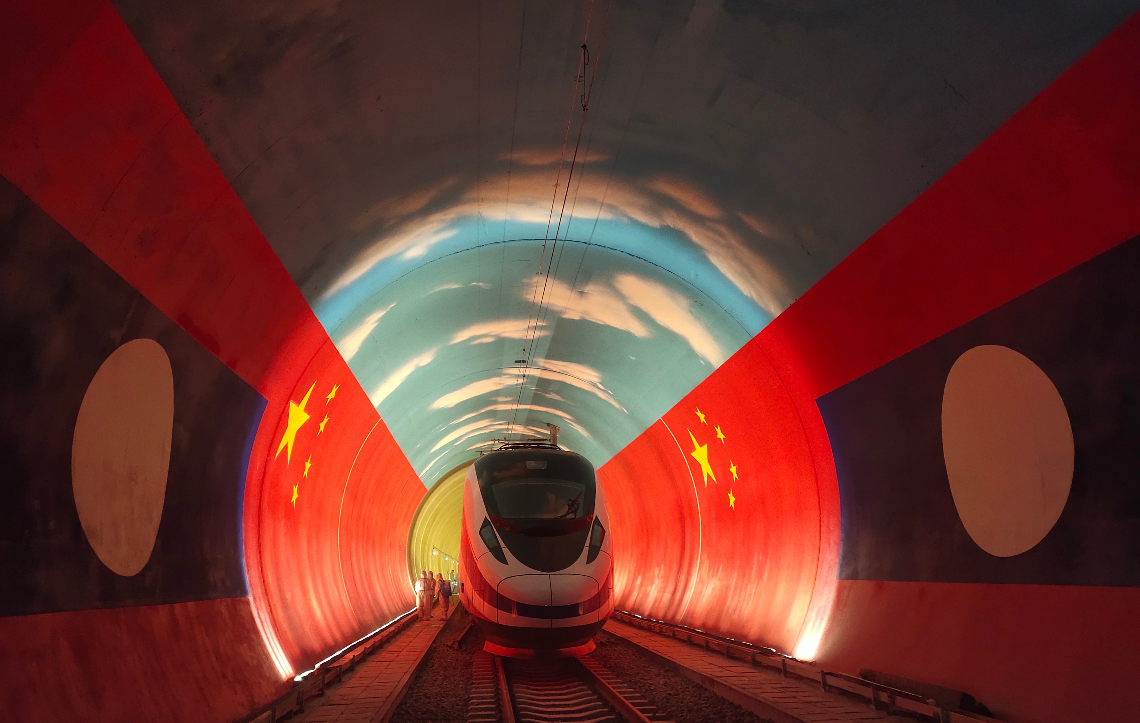 A train passes by the China-Laos borderline inside a tunnel. Photo: Xinhua