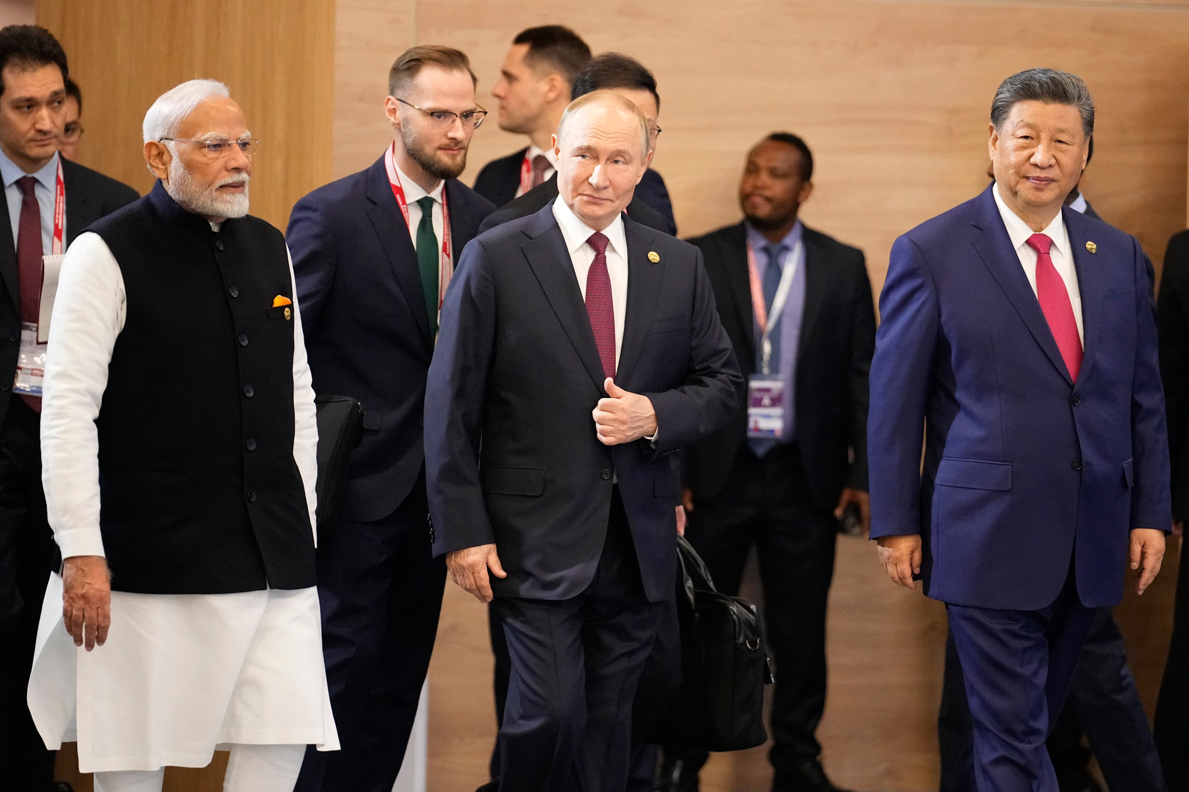 From left, Indian Prime Minister Narendra Modi, Russian President Vladimir Putin and Chinese President Xi Jinping attend a family photo ceremony prior to the Brics Summit plenary session in Kazan, Russia on October 23. Photo: AP