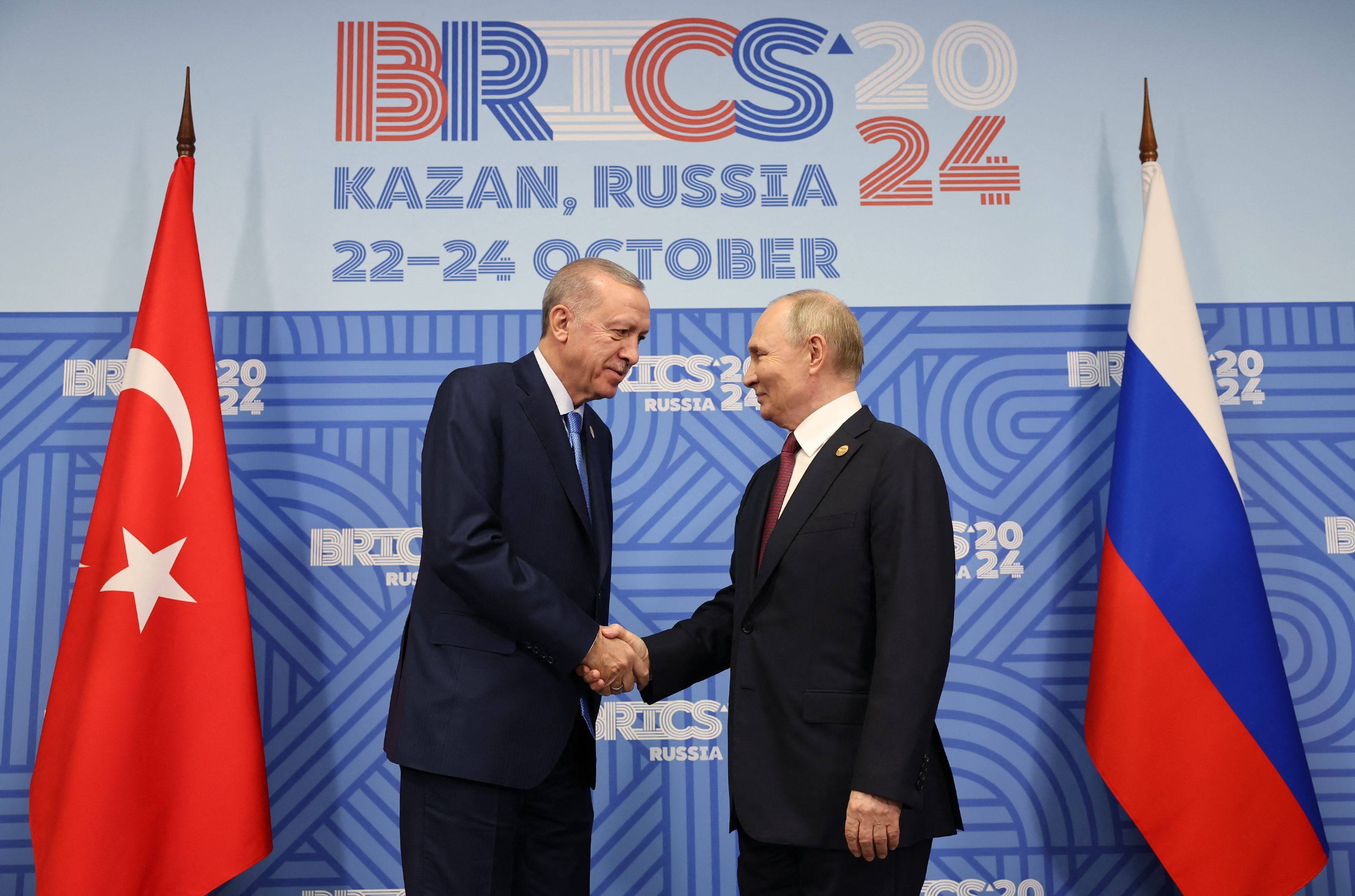 Turkey’s President Recep Tayyip Erdogan (left) shakes hands with Russia’s Vladimir Putin on the sidelines of the Brics summit in Kazan on Wednesday. Photo: Turkish Presidency Press Office / AFP